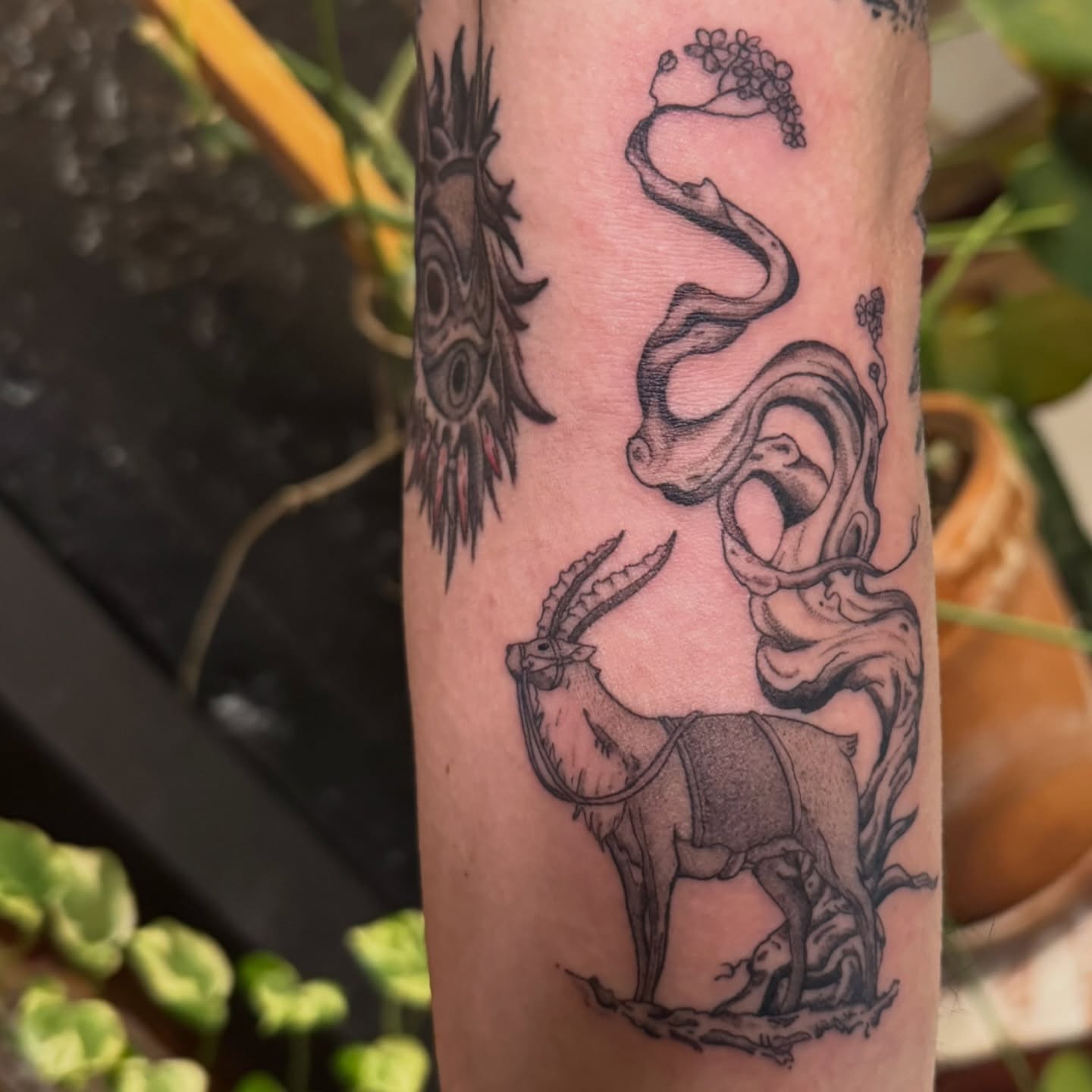 Goat and snake black and grey tattoo on the forearm by jake.inks