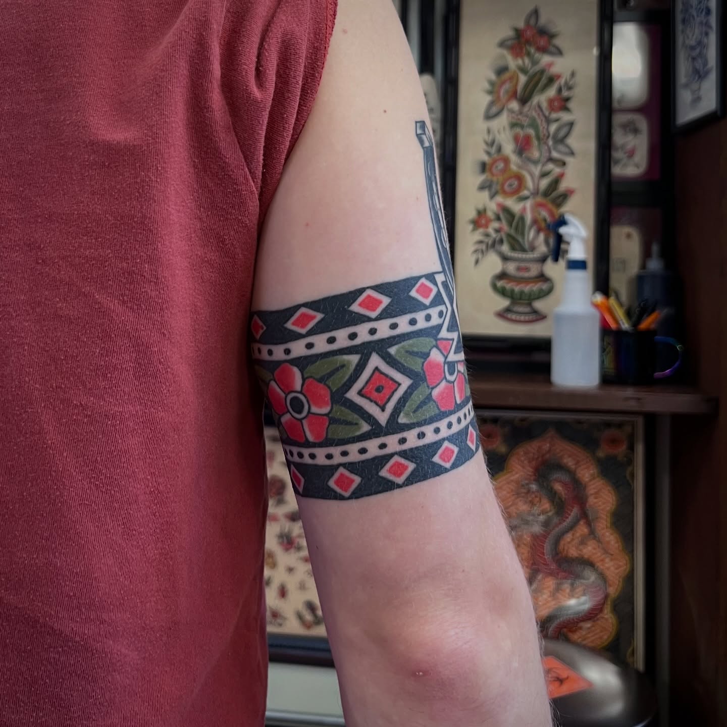 Floral band American traditional tattoo on the forearm by Brian Visser