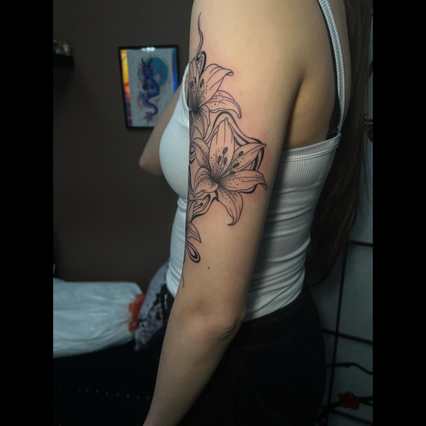 Lily dotwork tattoo on the forearm by Ali, Cedar Rapids, Iowa