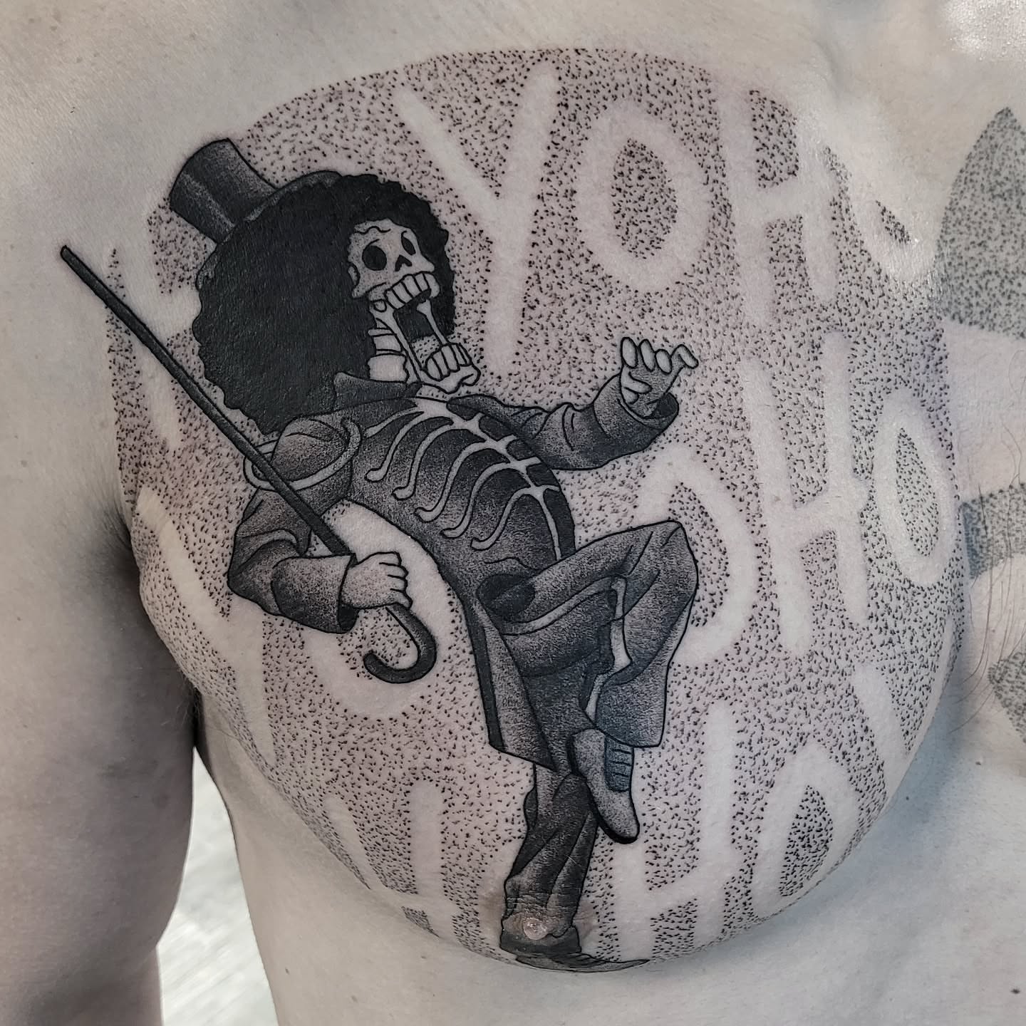 Skeleton in top hat dotwork tattoo on the shoulder by Kirk George