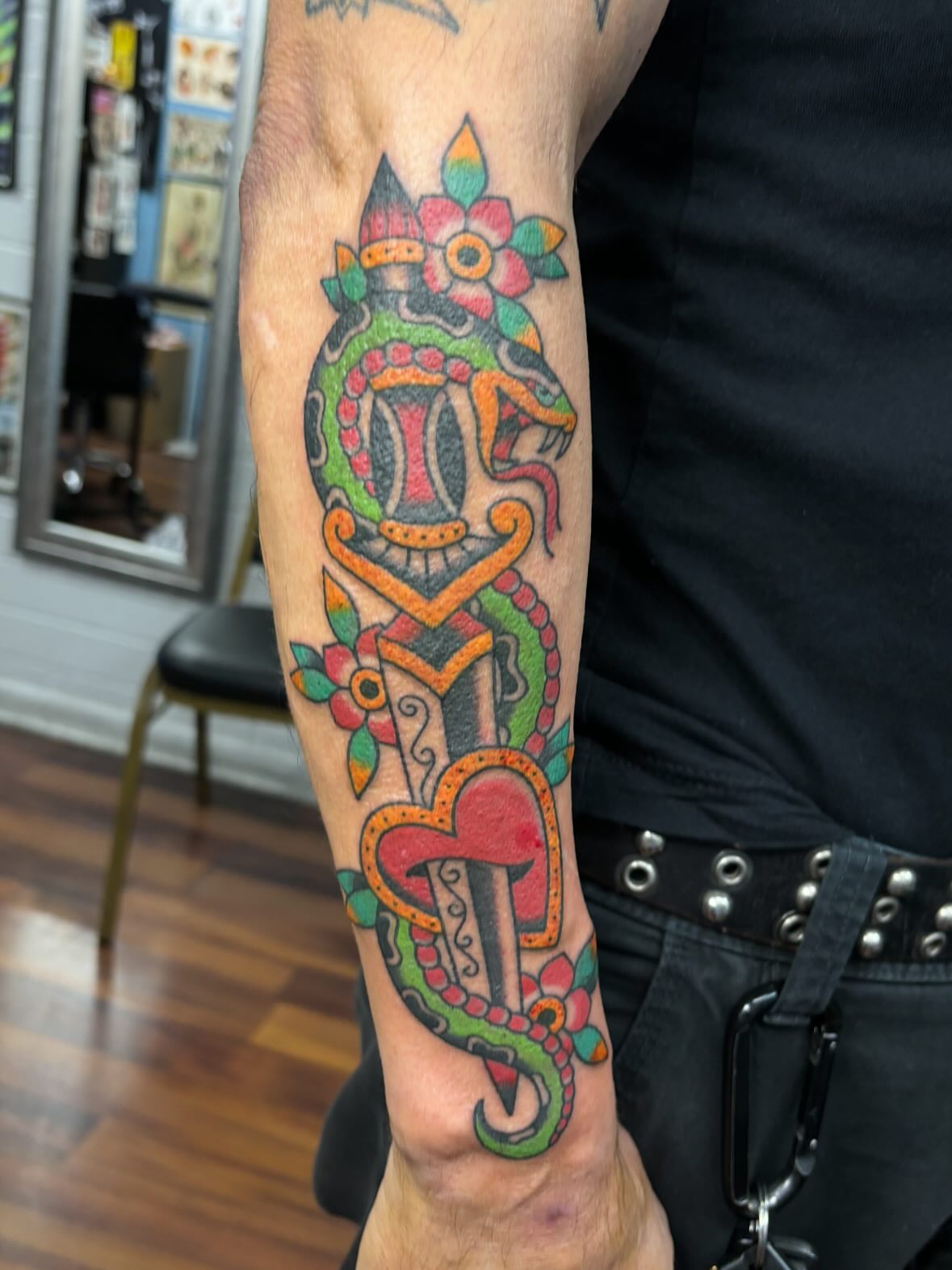 Mask and floral elements American traditional tattoo on the forearm by ๐๐๐ฑ๐ฑ๐ฌ๐ฌ ๐๐ฏ๐ฑ๐ฆ๐ฐ๐ฑ