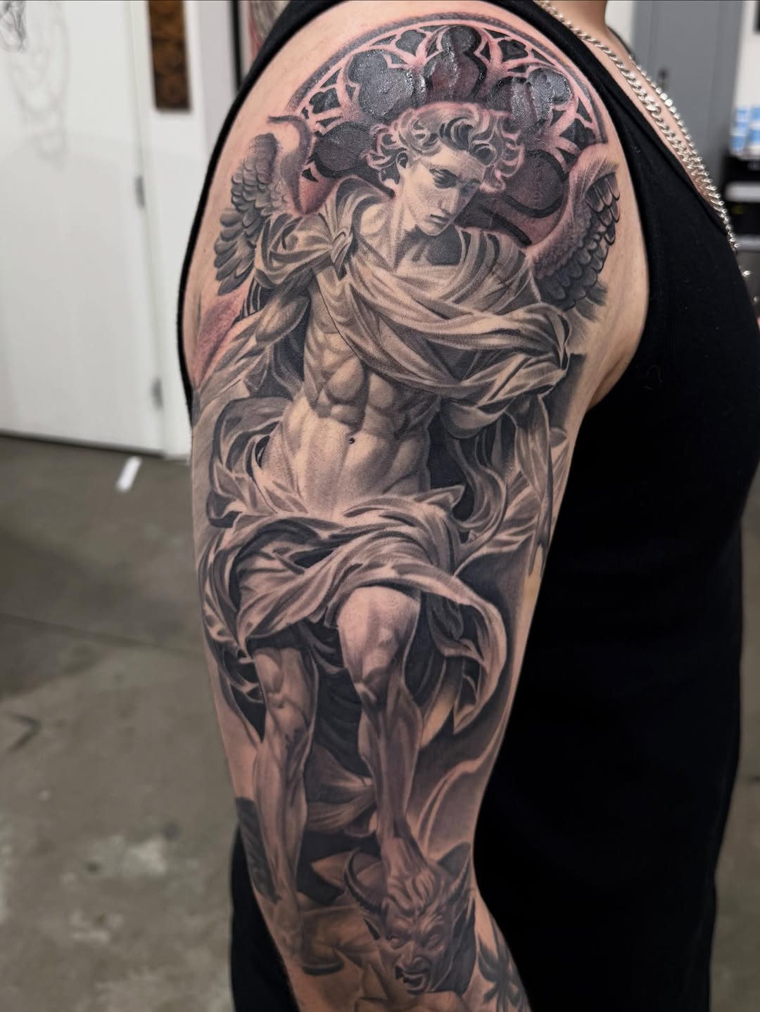 Tattoo by @tattoo_isaac562 — realism, black_and_grey