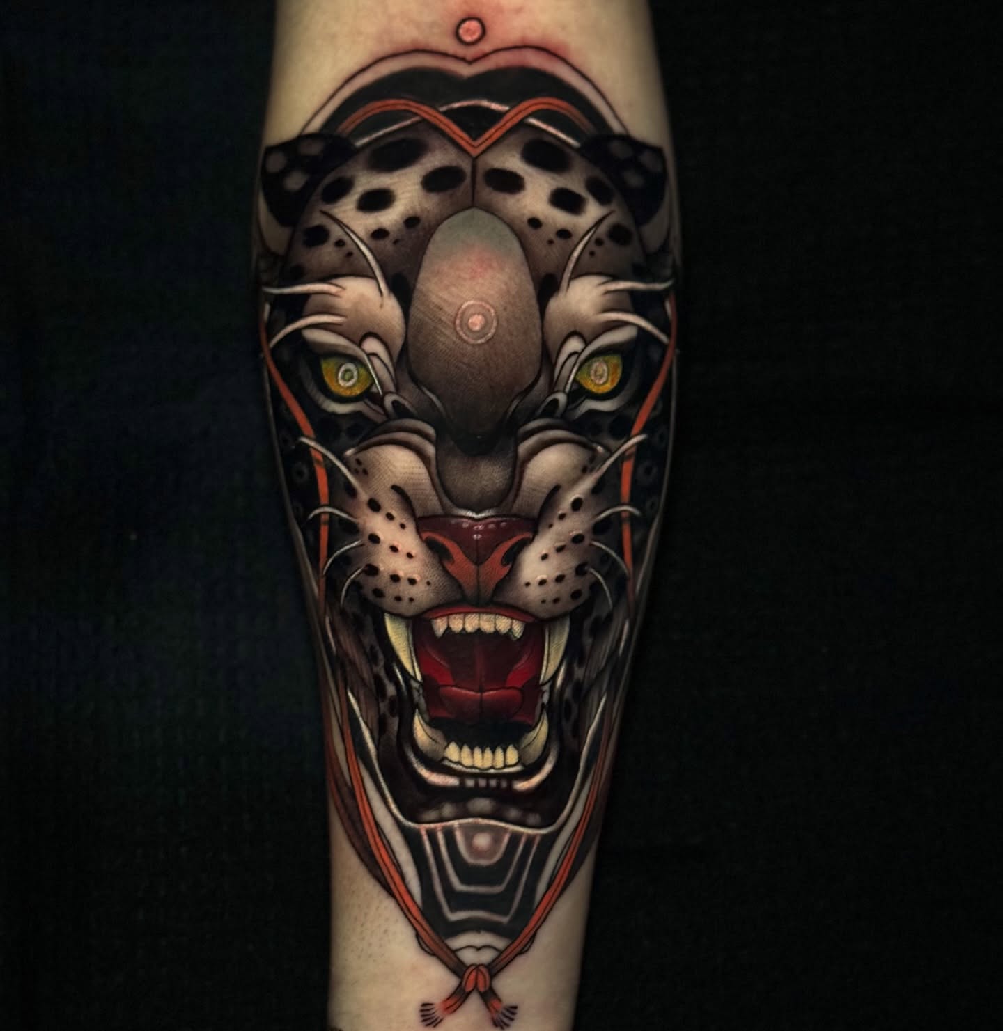 Roaring panther geometric tattoo on the forearm by Jaxx Kesler