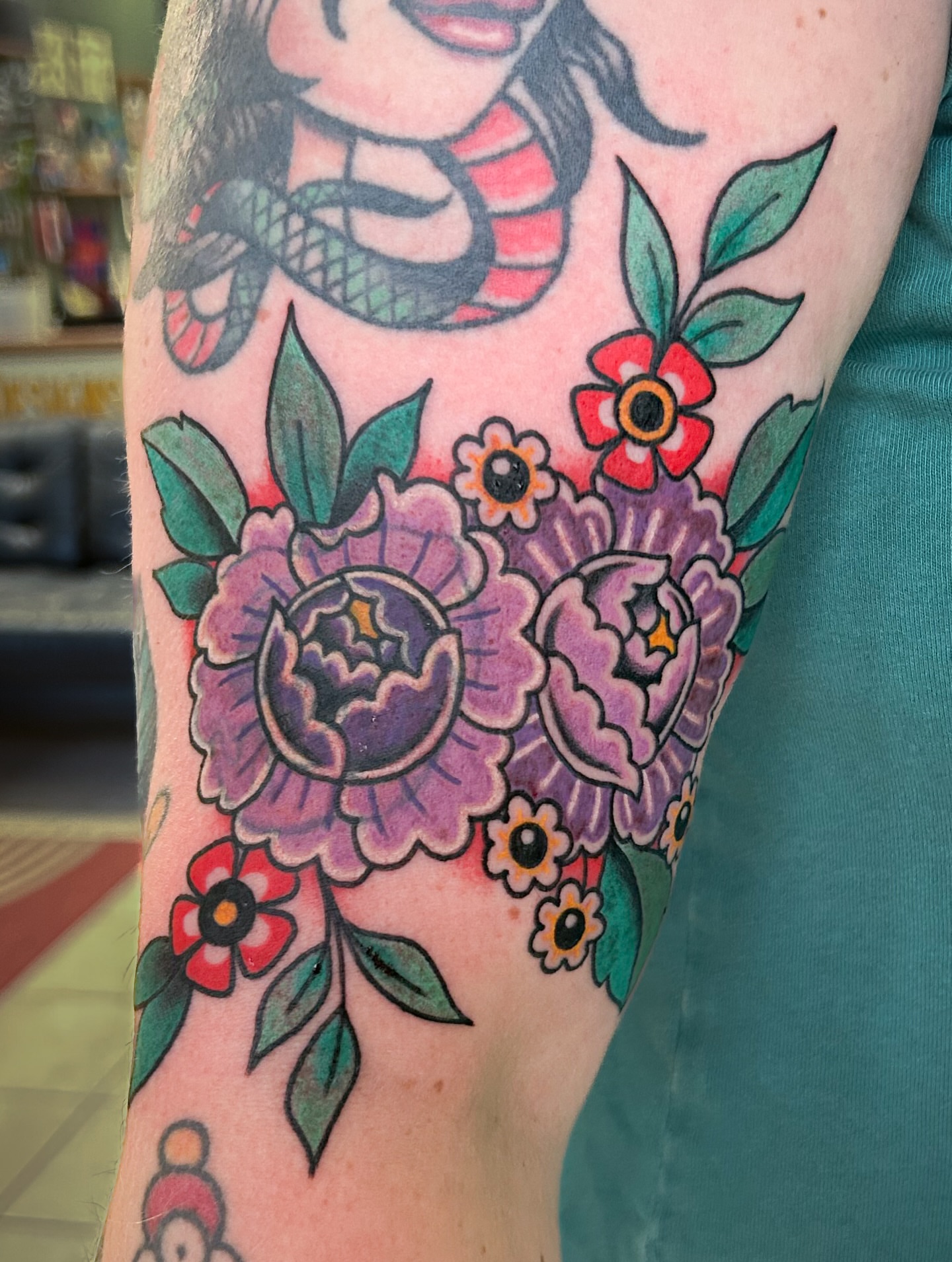 Flowers American traditional tattoo on the forearm by Jessica Oram Brockman, Dayton, Ohio