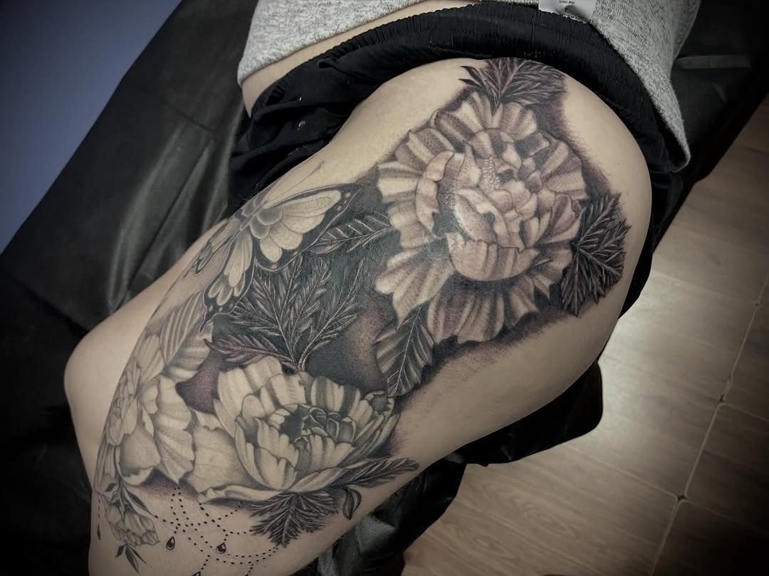 Peonies and butterfly dotwork tattoo on the thigh by Ashly Hutchens, Richmond, Virginia