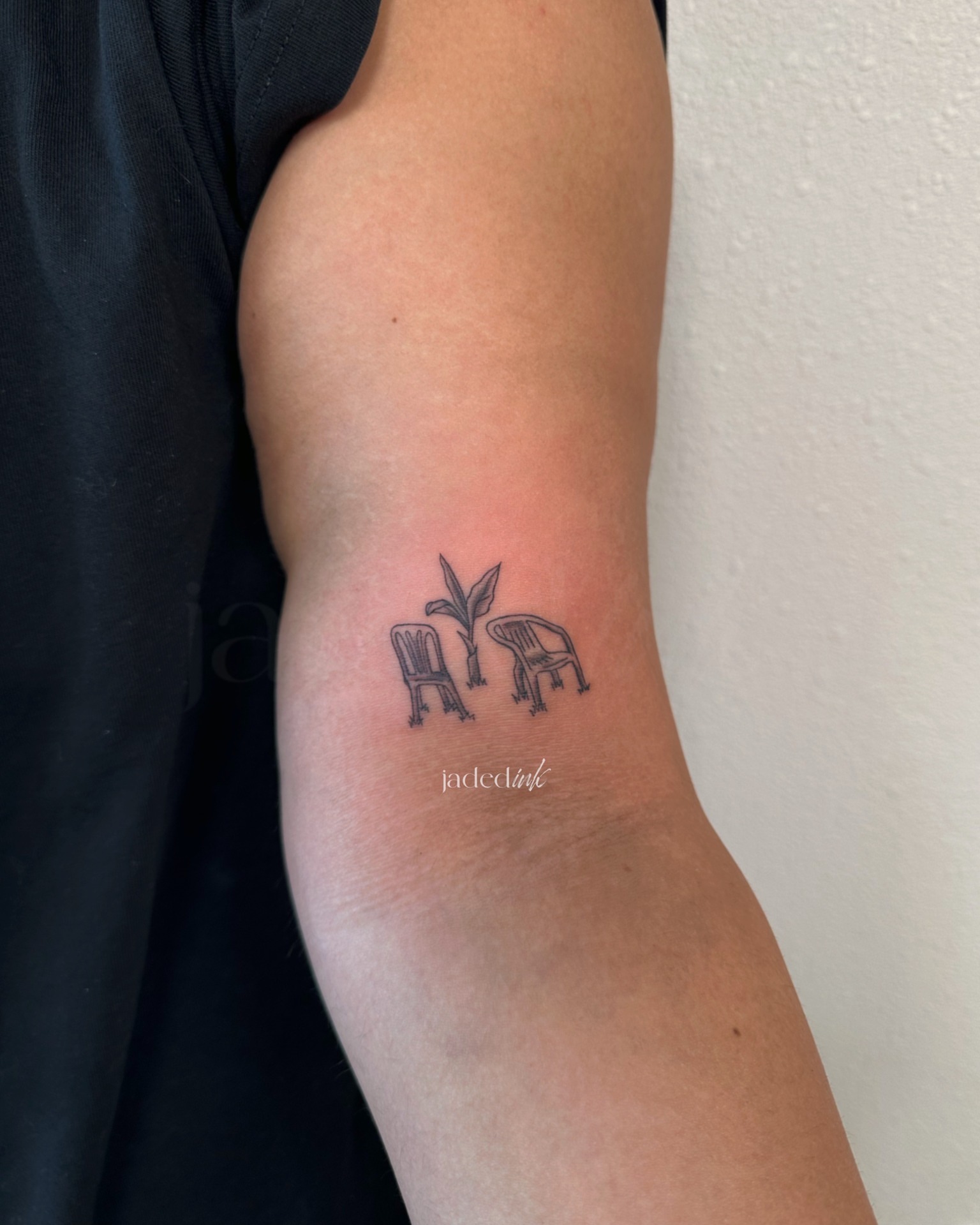 Two chairs and plant minimalist tattoo on the forearm by 𝑱𝒂𝒅𝒆𝒅 𝑰𝒏𝒌 𝑷𝒆𝒓𝒎𝒂𝒏𝒆𝒏𝒕 𝑴𝒂𝒌𝒆𝒖𝒑 & 𝑻𝒂𝒕𝒕𝒐𝒐