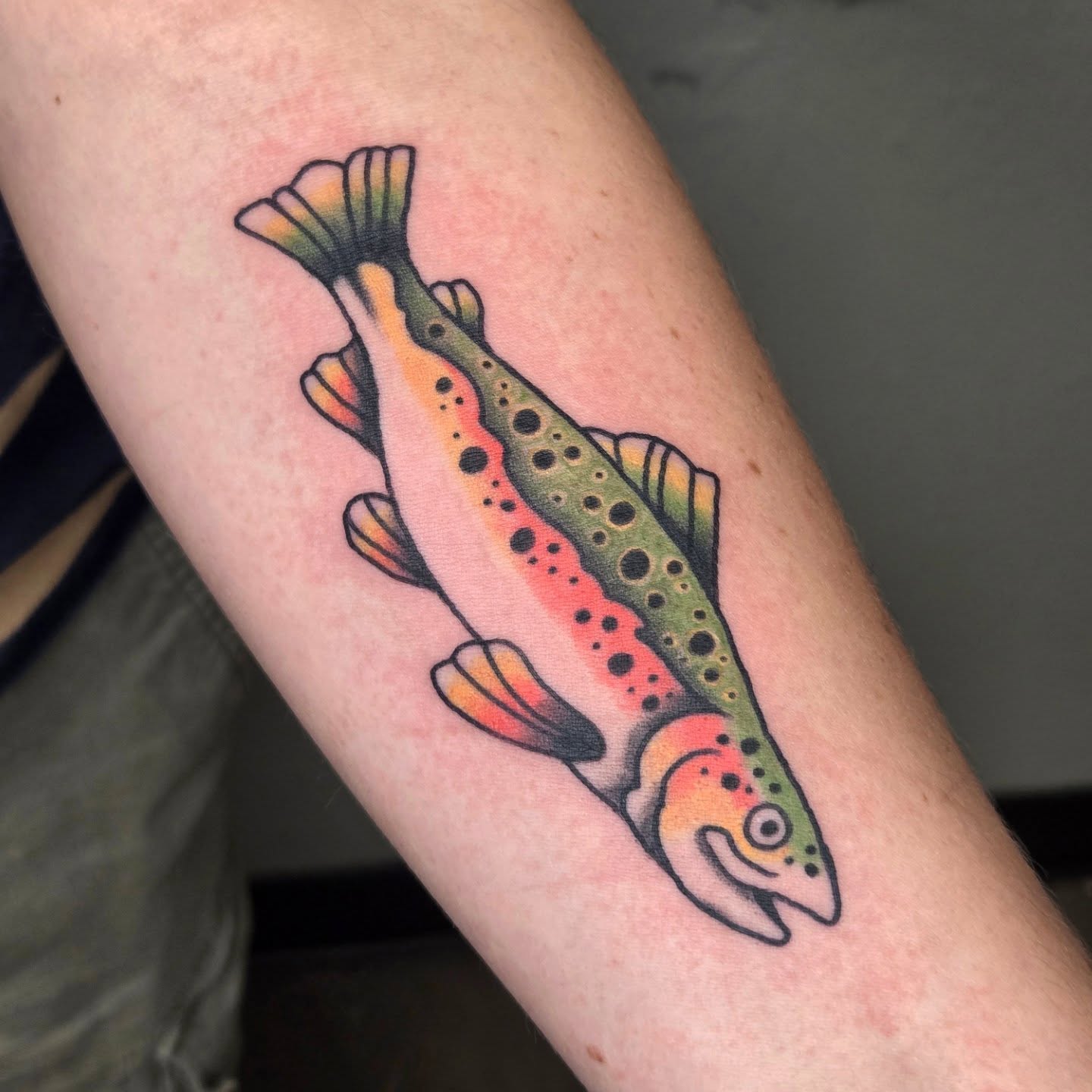 Rainbow trout American traditional tattoo on the forearm by alec