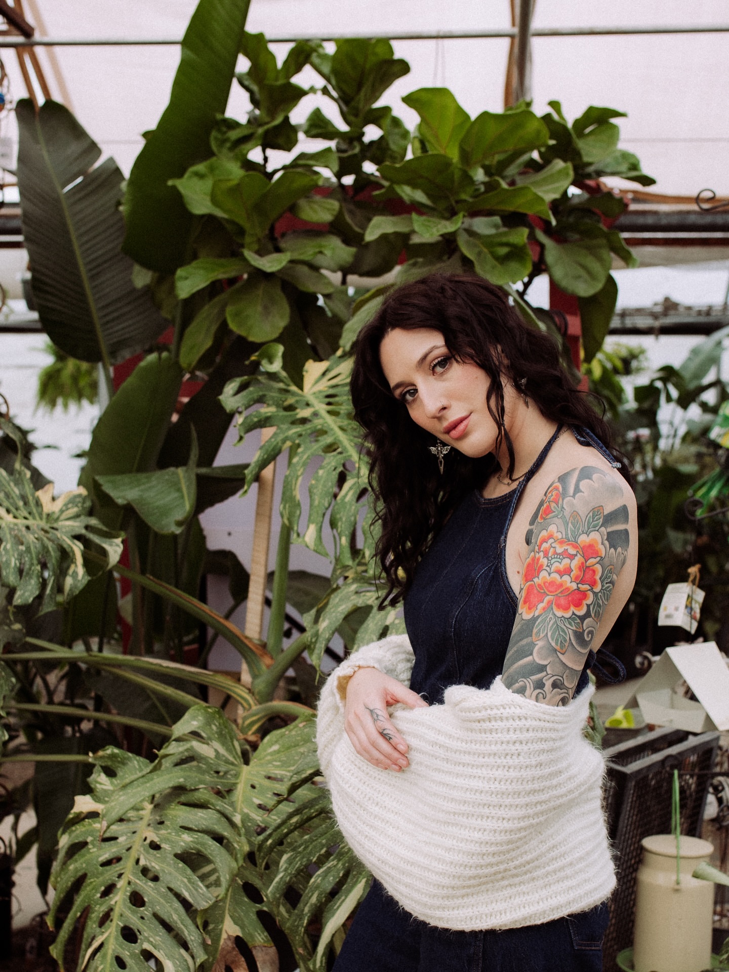 Floral new school tattoo on the upper arm by Chloe Marie