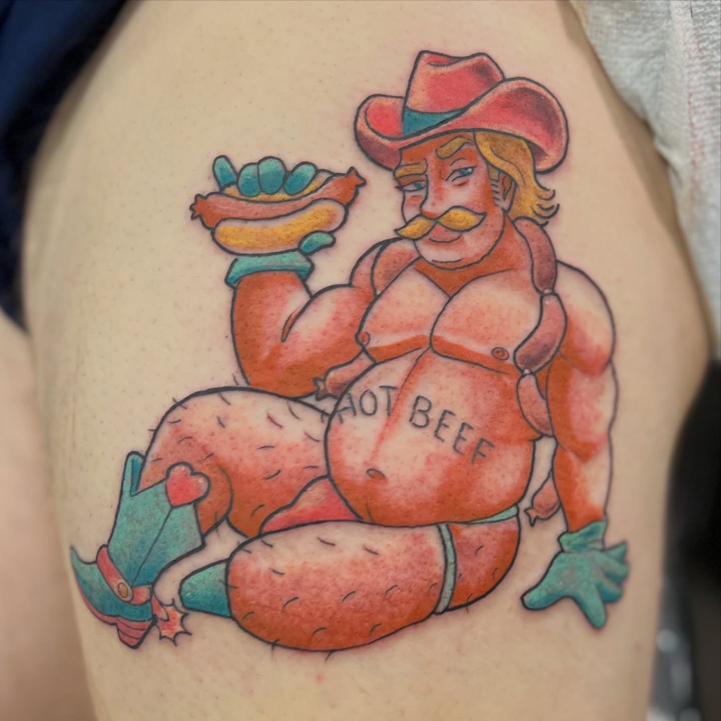 Fat cowboy holding hot dog American traditional tattoo on the thigh by Alex Santaloci