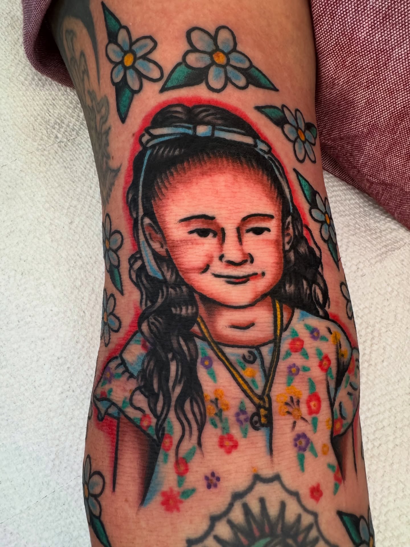 Child portrait American traditional tattoo on the forearm by Kenny Kastro