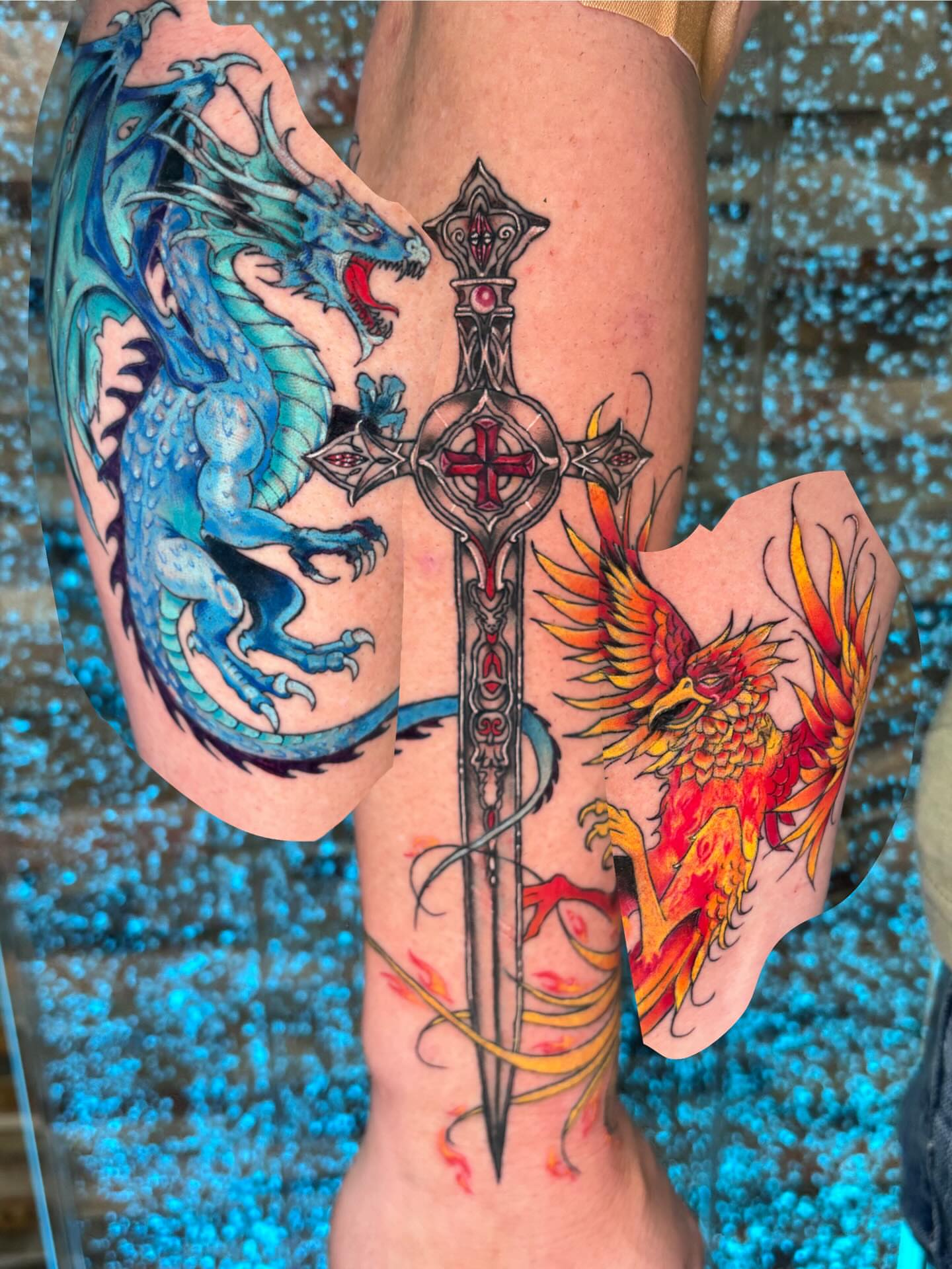Dragon, sword, phoenix neo-traditional tattoo on the thigh by Stephanie Rowe