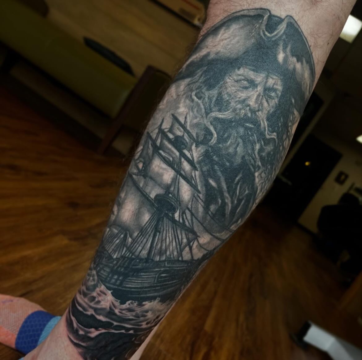 Pirate and ship realism tattoo on the forearm by Taylor Santavicca