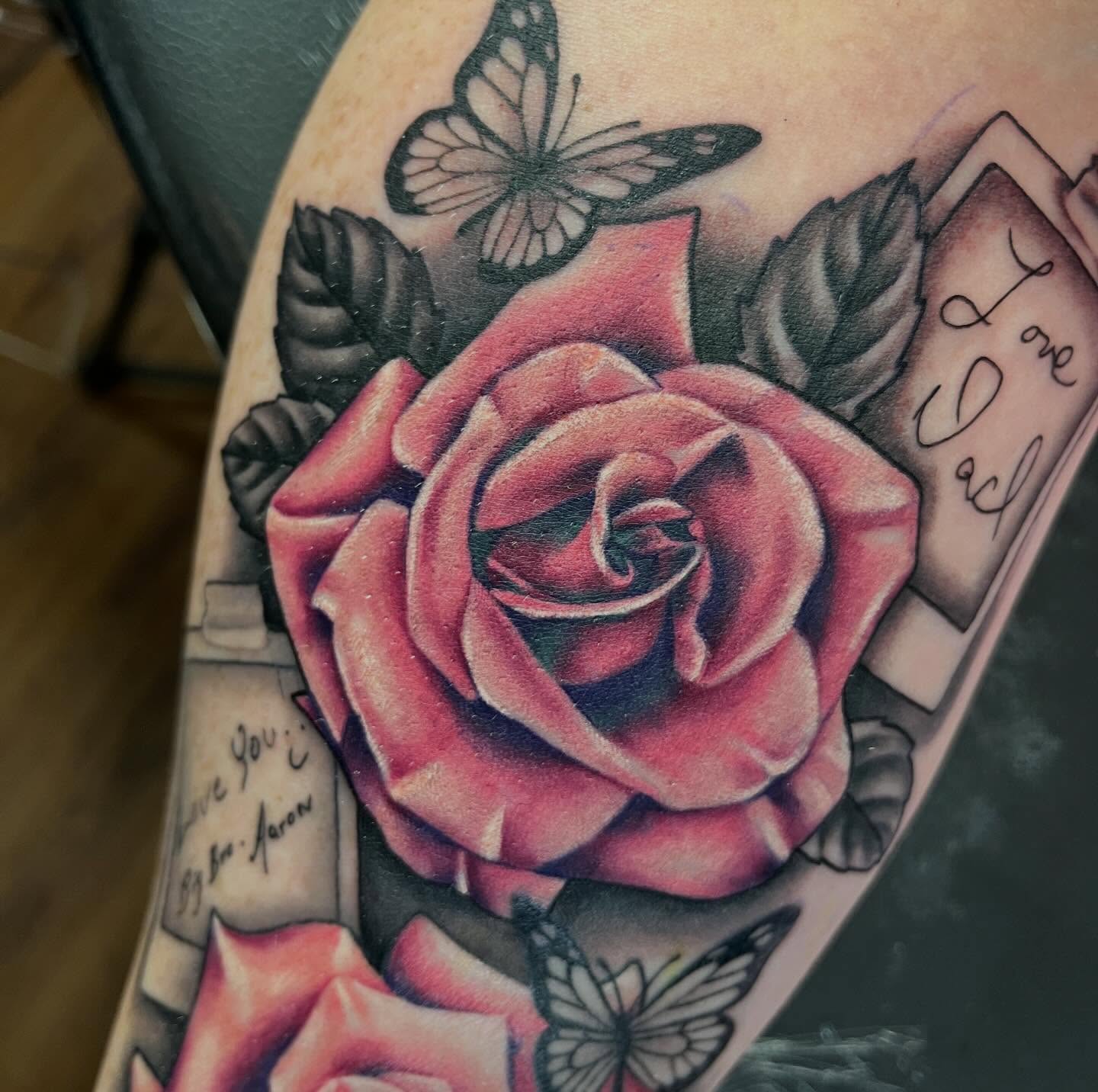 Rose and butterflies American traditional tattoo on the forearm by Taylor Santavicca