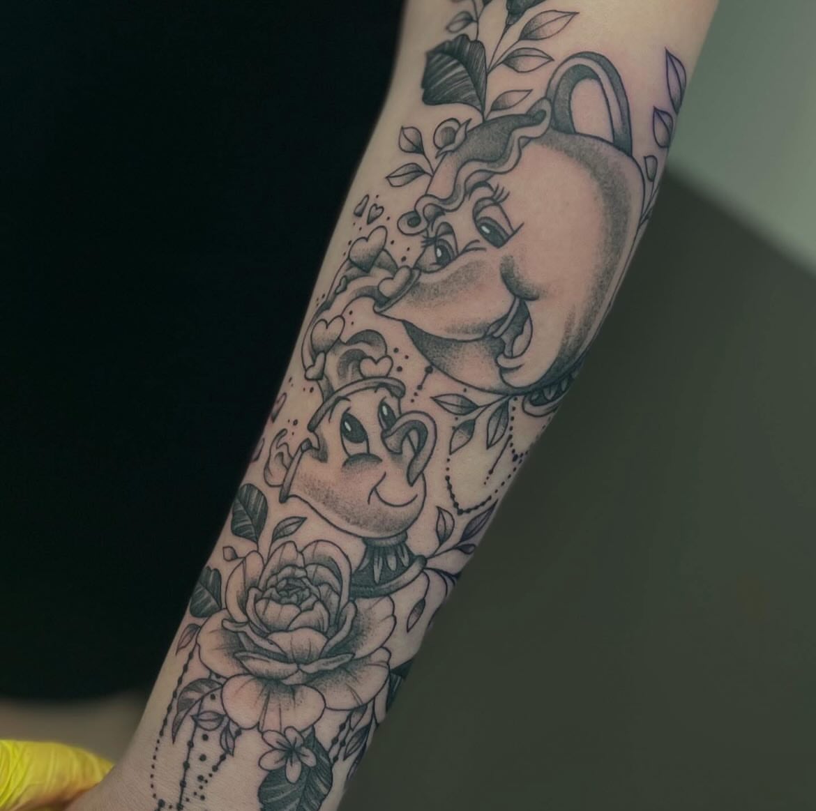 Elephant and roses dotwork tattoo on the forearm by Taylor Santavicca