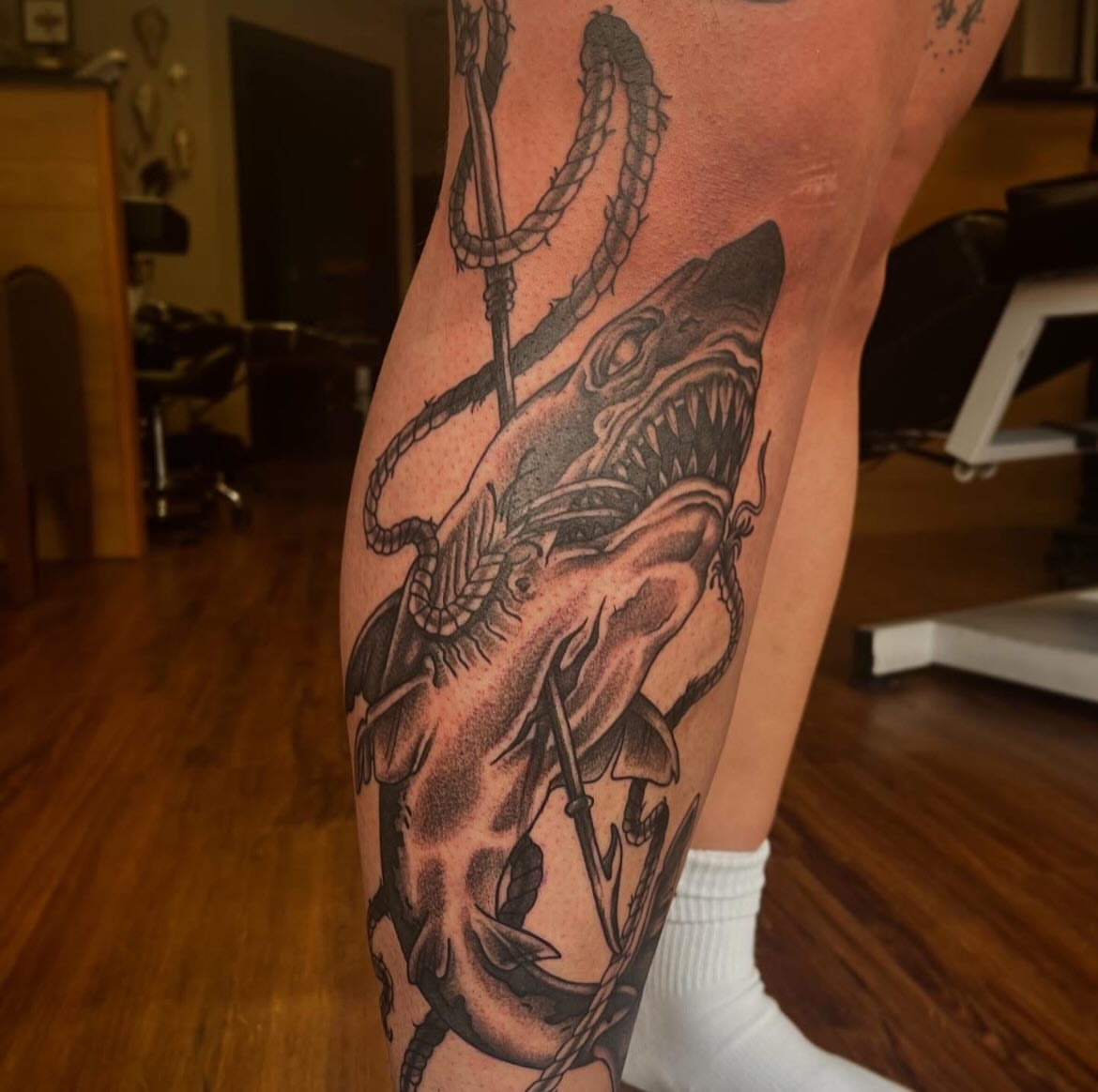 Shark black and grey tattoo on the leg by Taylor Santavicca