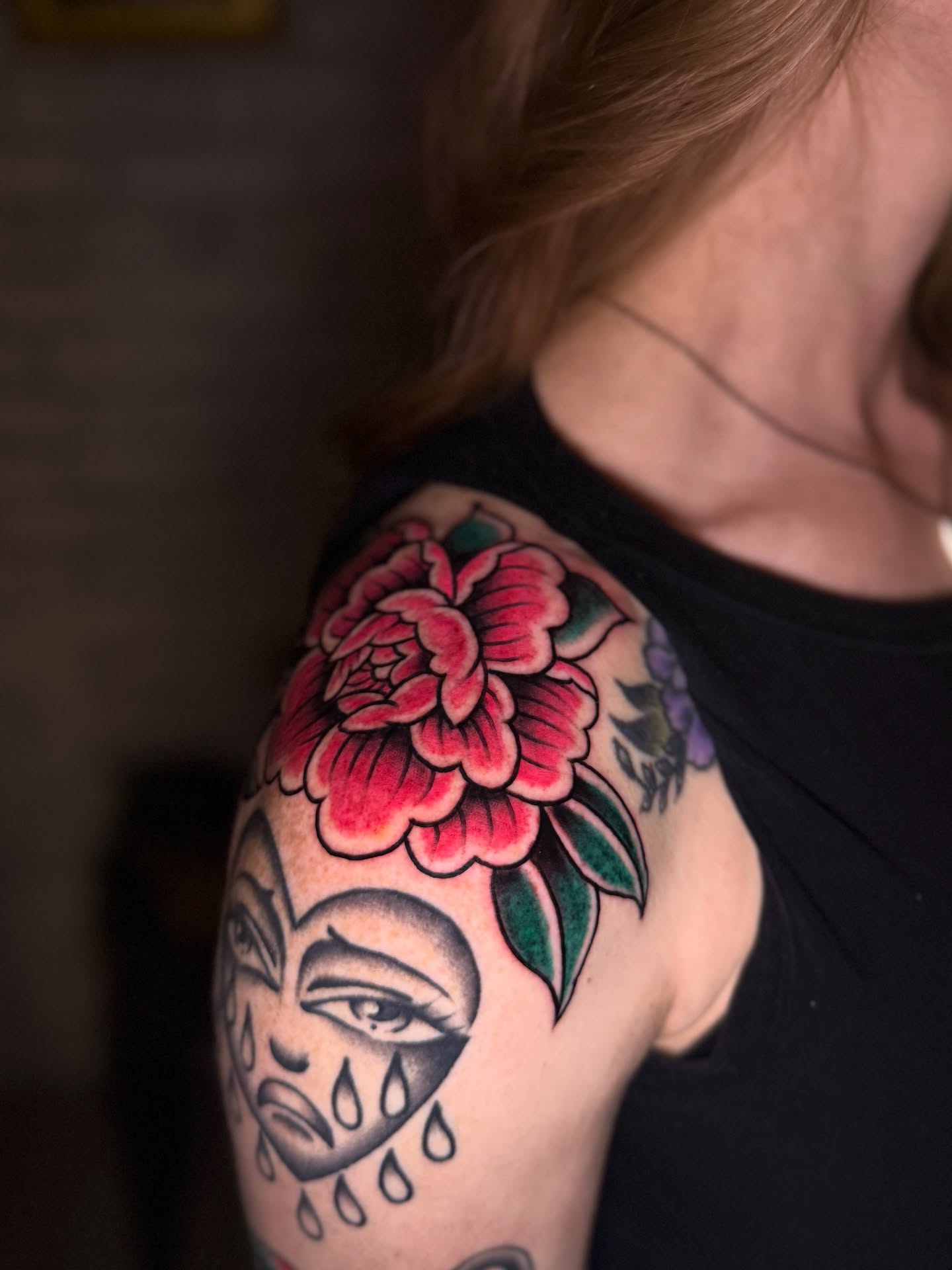 Woman's face with flower American traditional tattoo on the shoulder by Preston-NJ Tattoo Artist