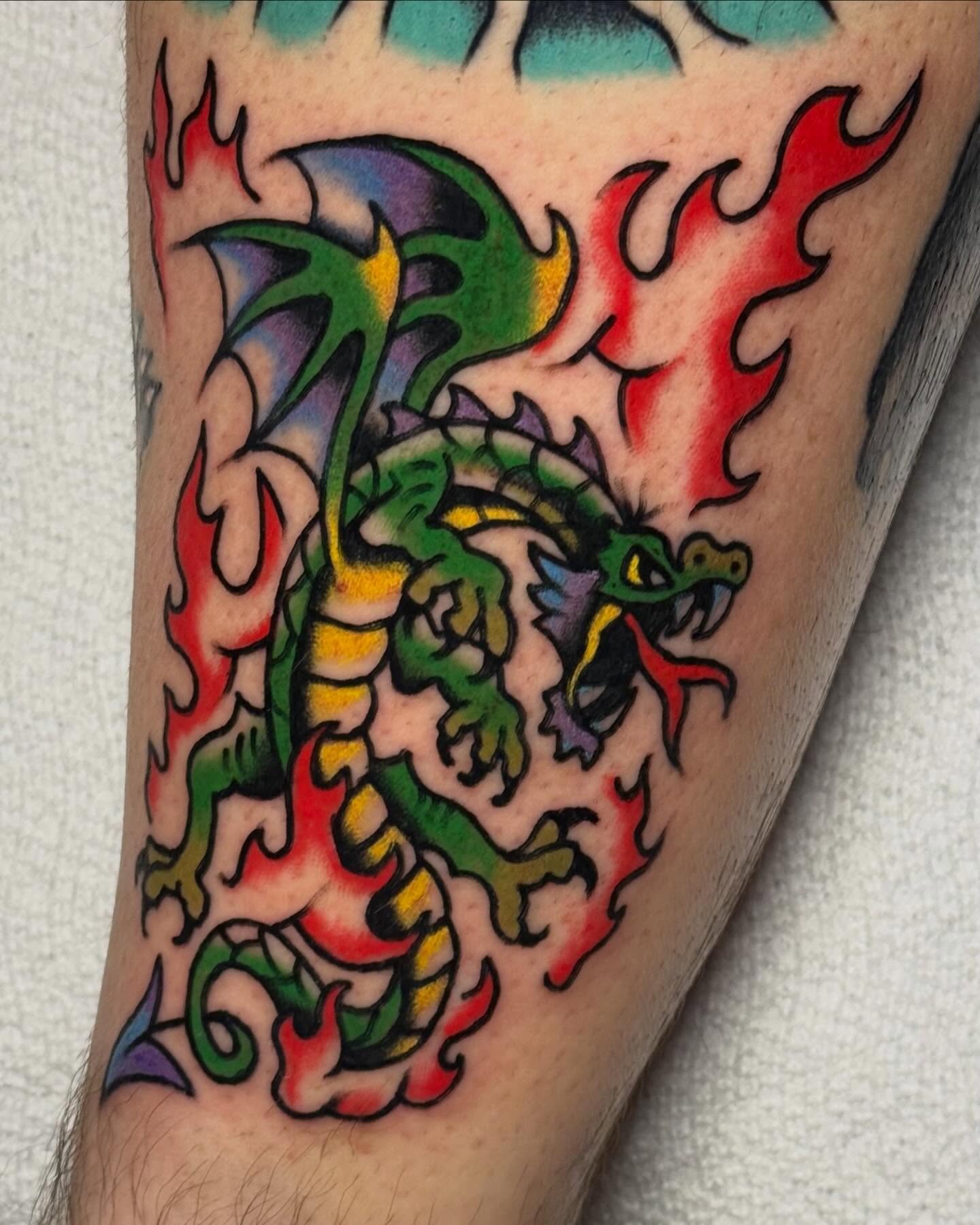 Dragon American traditional tattoo on the forearm by Ty Elias