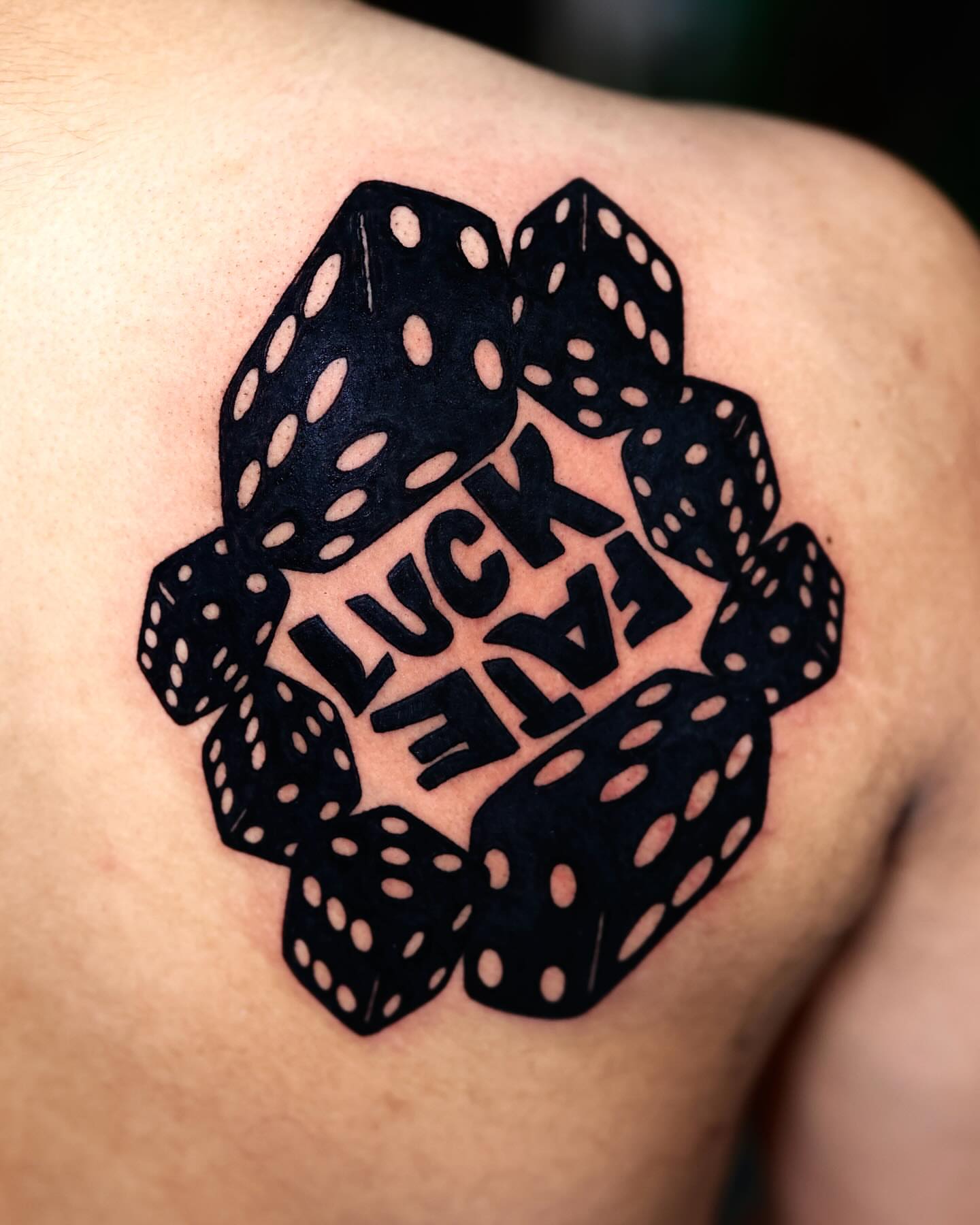 Dice and text black and grey tattoo on the shoulder by Scott!!!