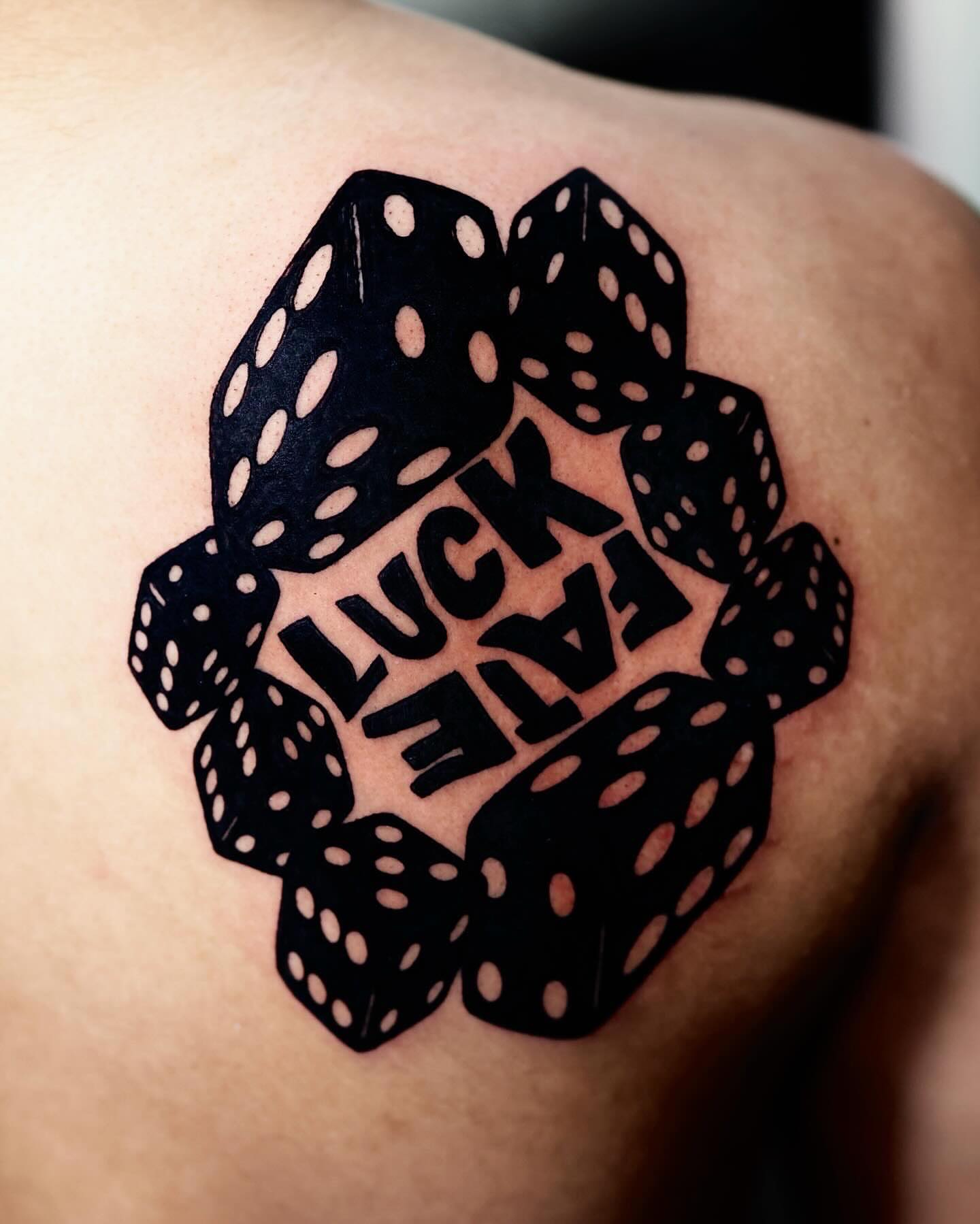 Dice and text black and grey tattoo on the shoulder by Scott!!!