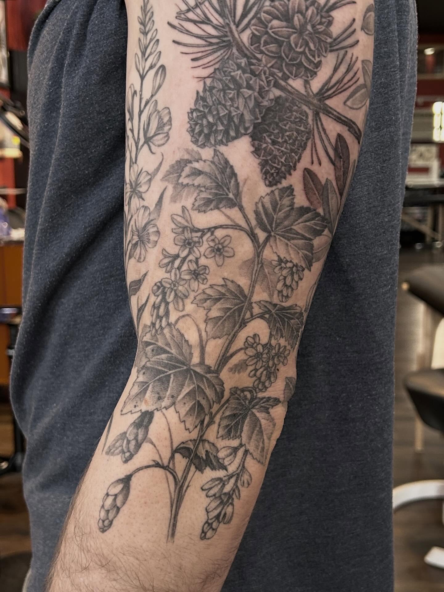 Botanical realism tattoo on the forearm by Tako, Seattle, Washington