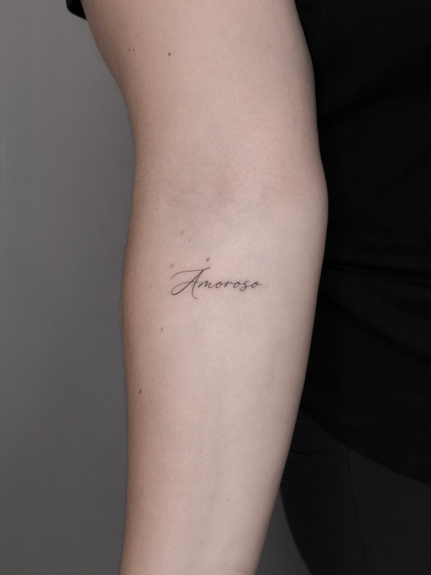 Amoroso lettering script tattoo on the forearm by Alina 🌙 Tattoo in Calgary 🇨🇦