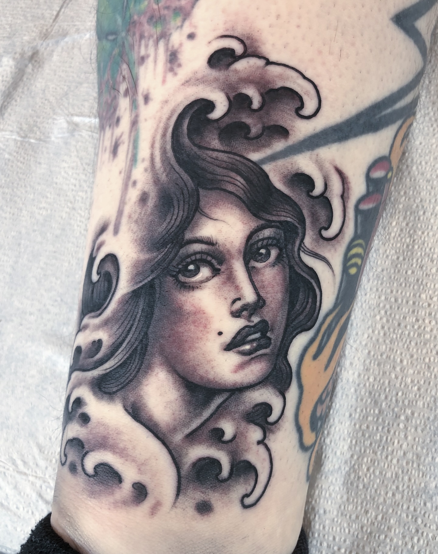 Woman's face American traditional tattoo on the forearm by Justin Weatherholtz, New York, New York