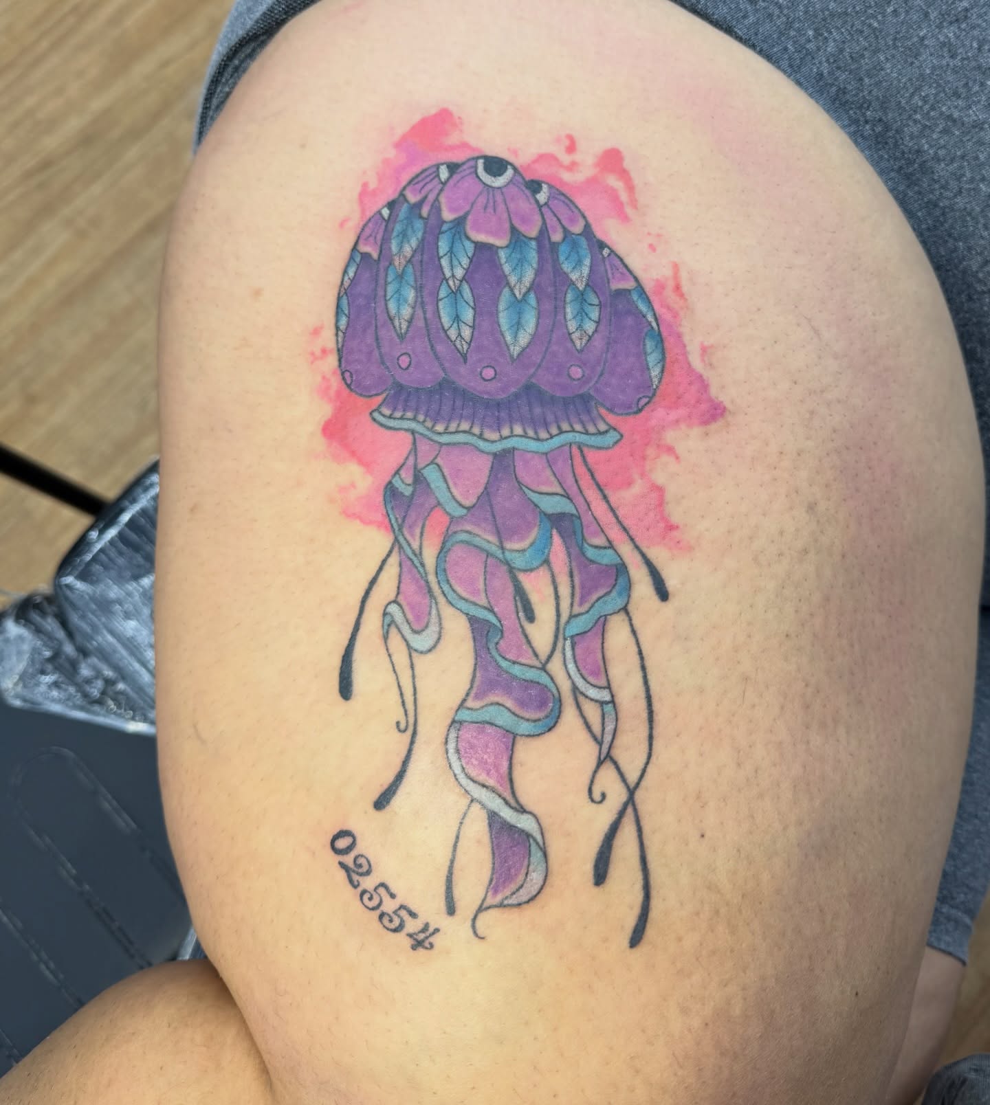 Jellyfish watercolor tattoo on the thigh by Celia