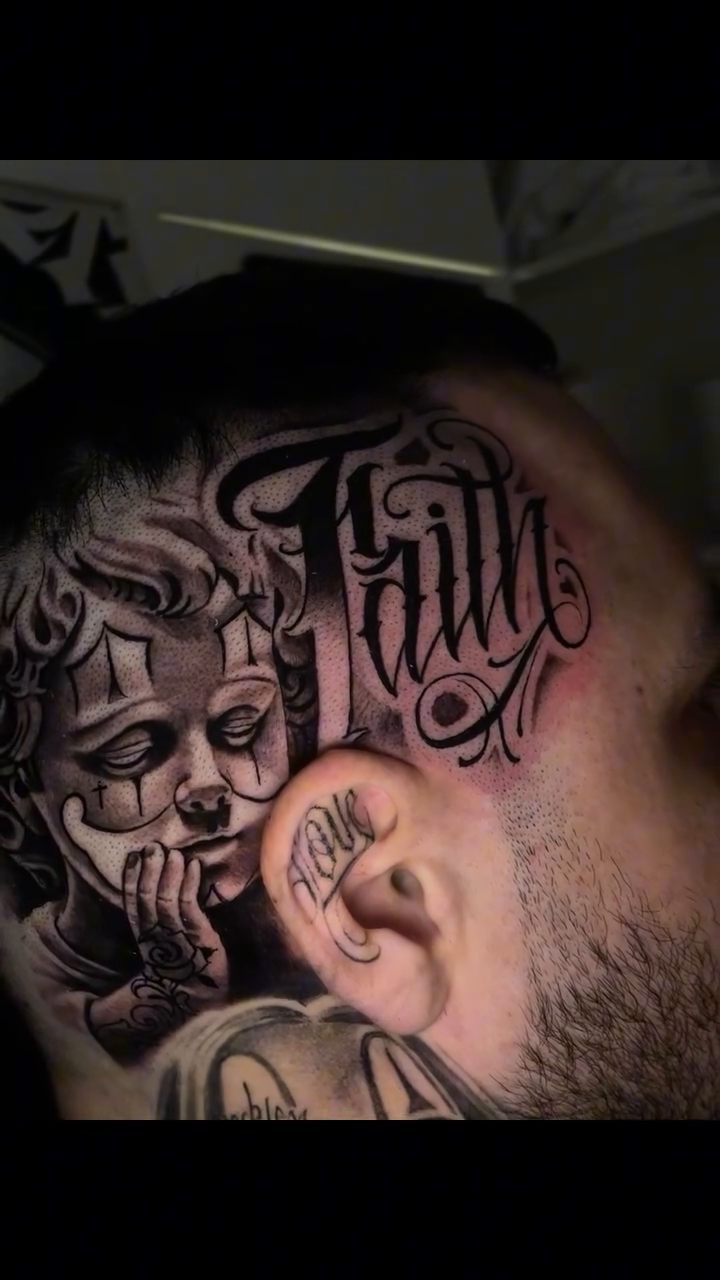 Cherub with script Chicano tattoo by Vic