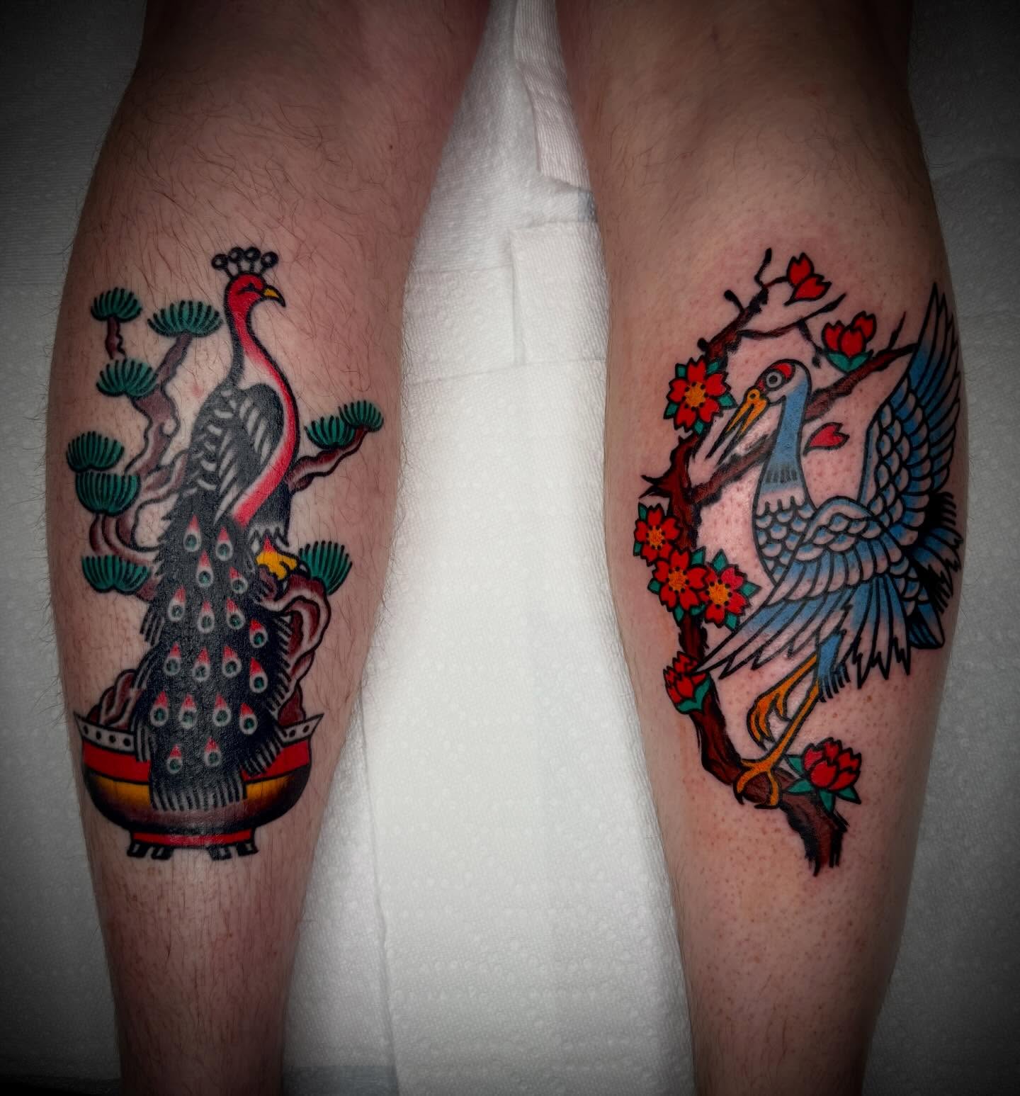 Peacock and crane American traditional tattoo on the leg by Tristan Bradshaw