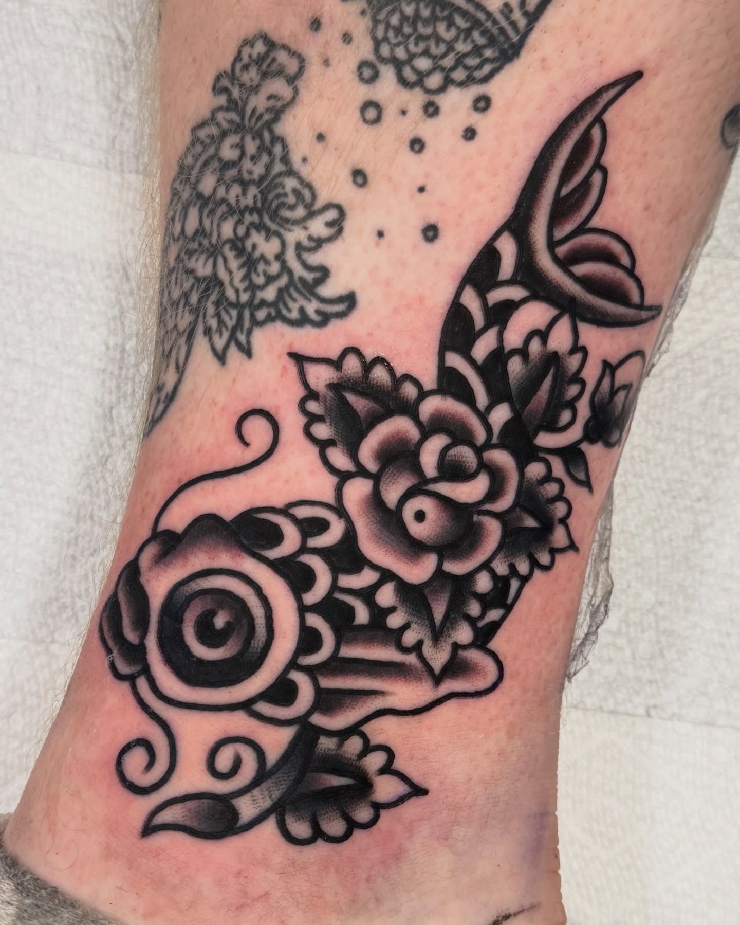 Koi fish American traditional tattoo on the forearm by Cullen Bleser Quinn