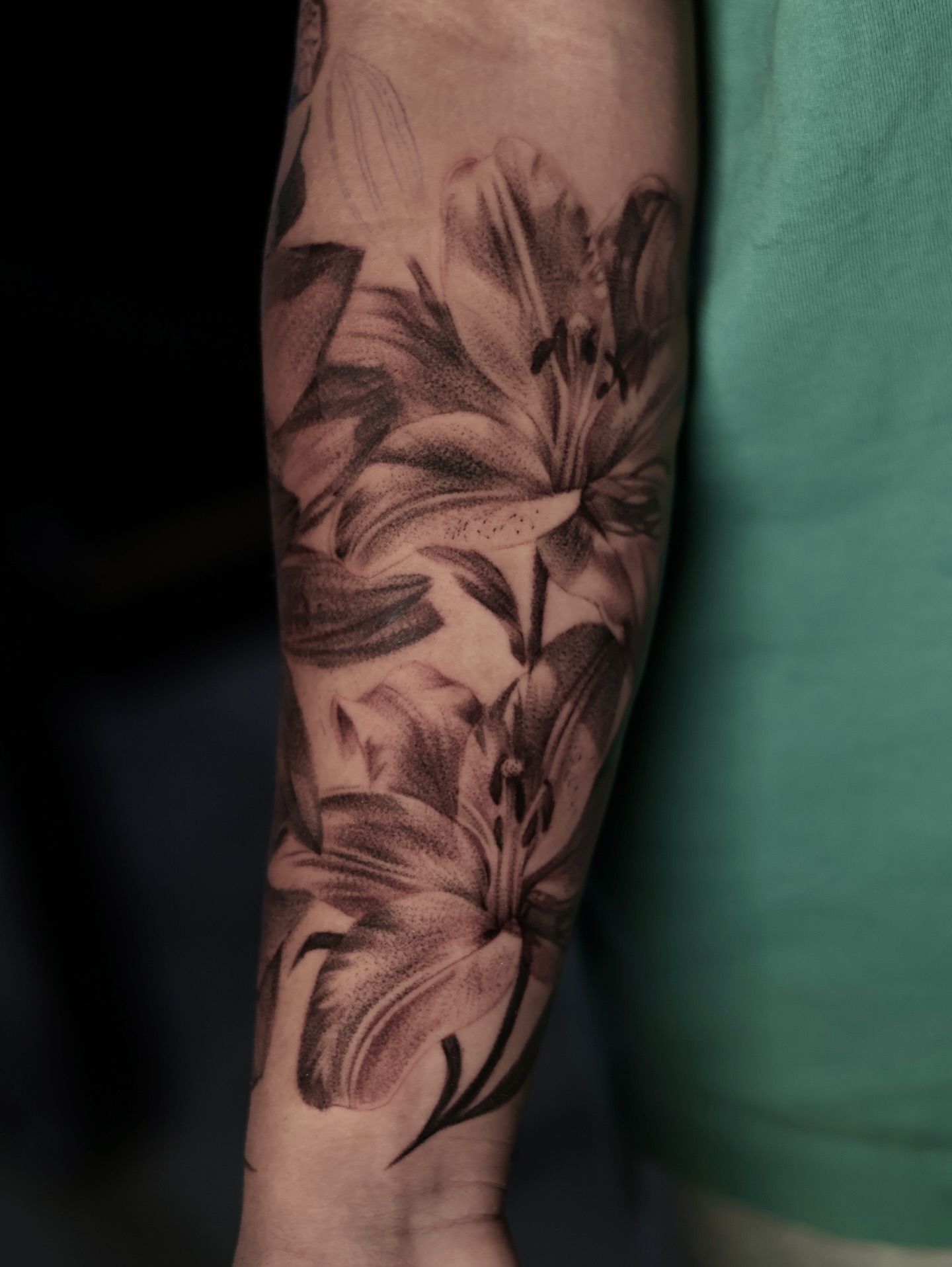Lily flowers dotwork tattoo on the forearm by Júlia Sorrino
