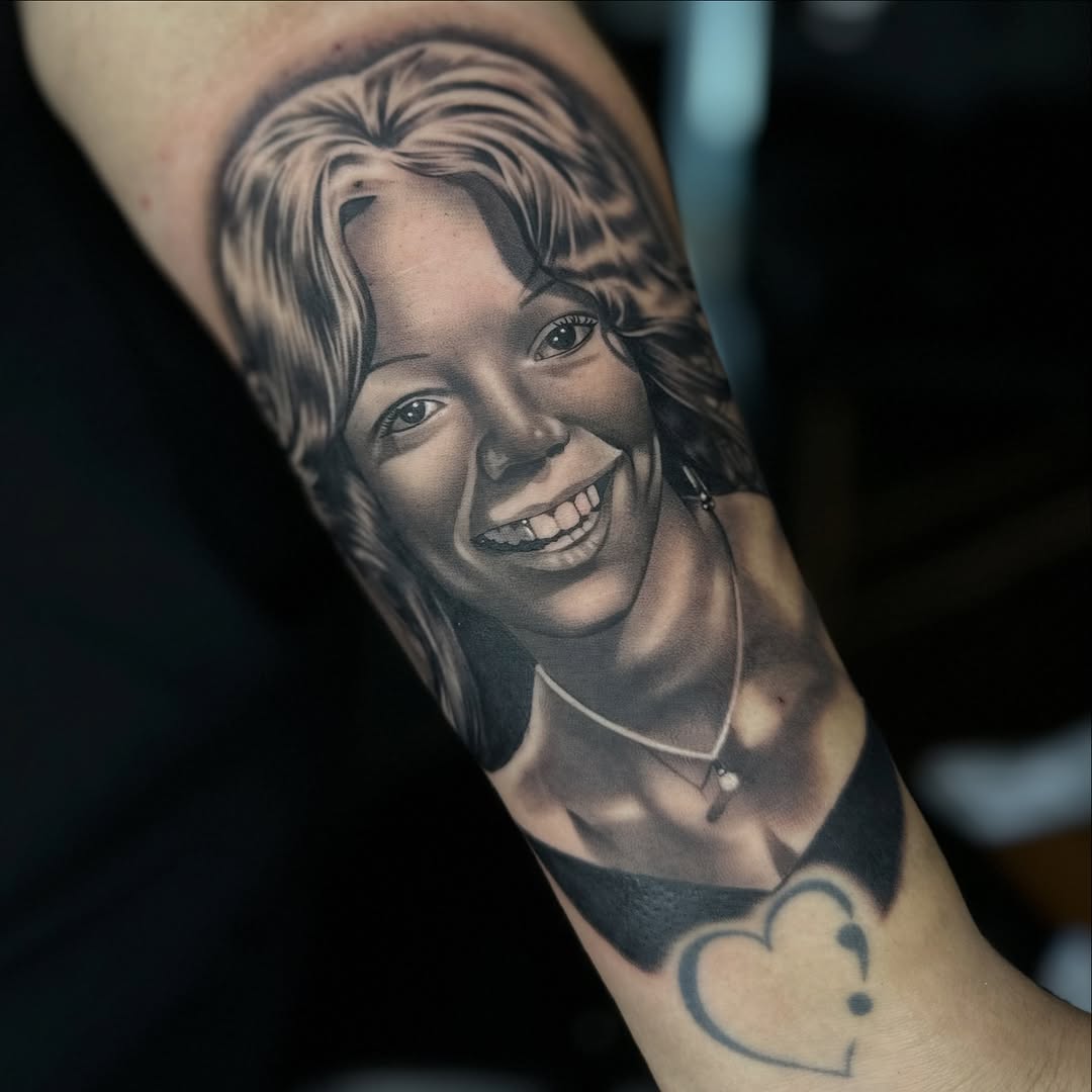 Portrait of a woman realism tattoo on the forearm by DH Tattooing
