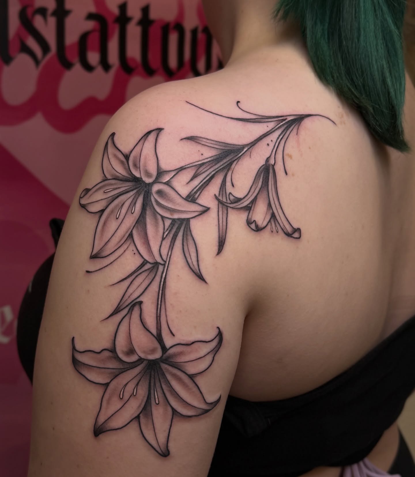 Lilies black and grey tattoo on the shoulder by Chelsea Graham, Seattle, Washington