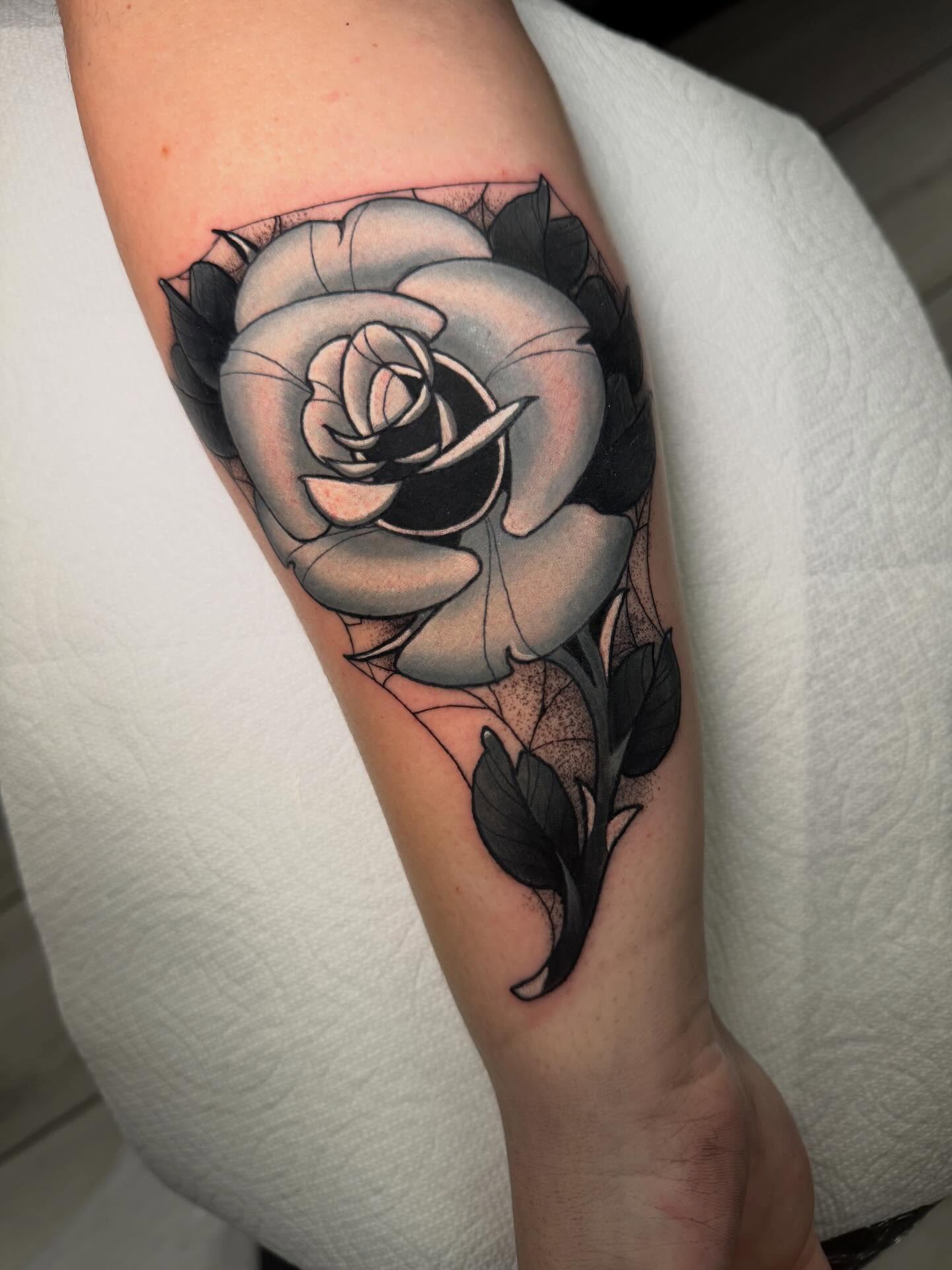 Rose black and grey tattoo on the forearm by Kenneth Ruiz