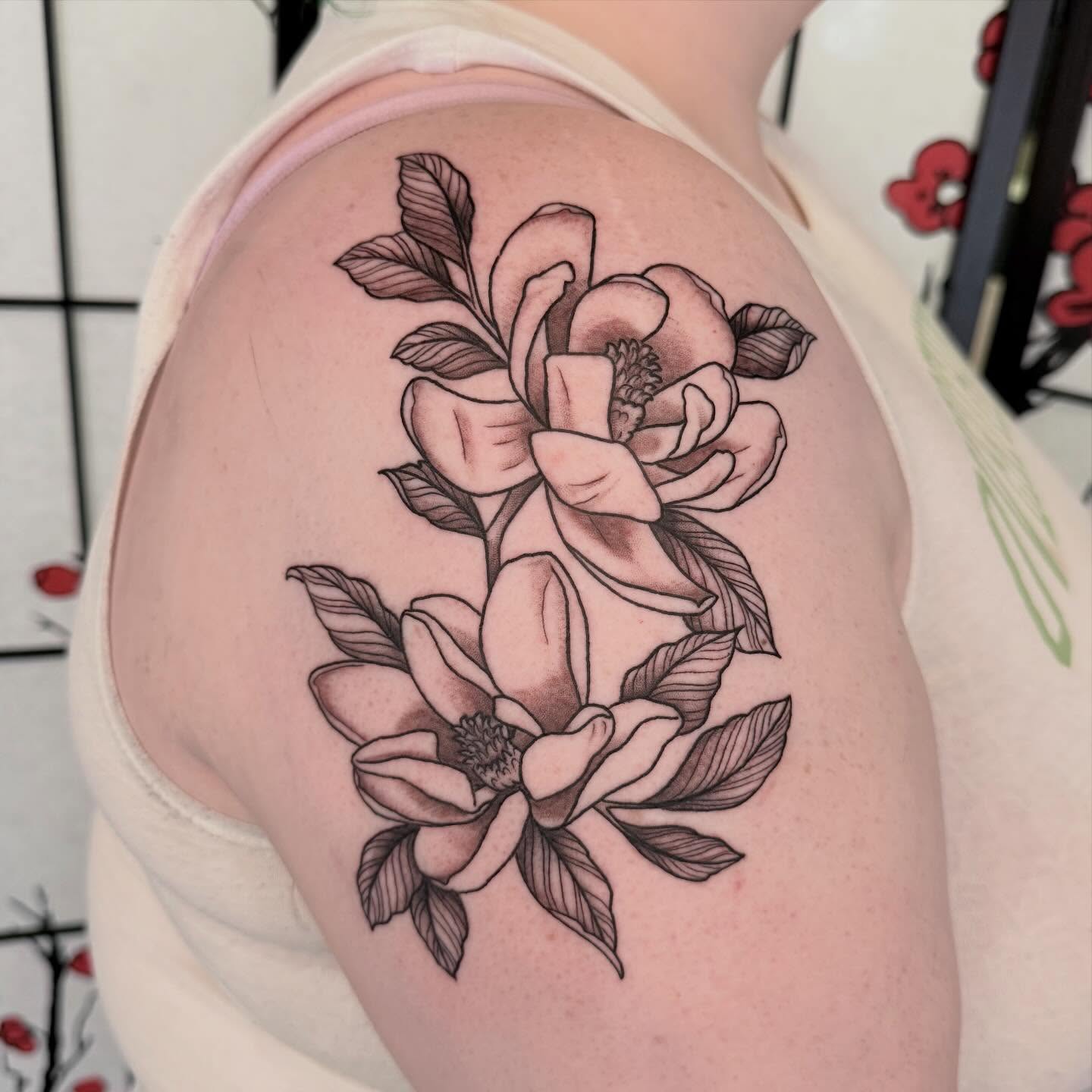 Magnolia flowers black and grey tattoo on the shoulder by Liz Glitz - Philadelphia Tattoo Artist
