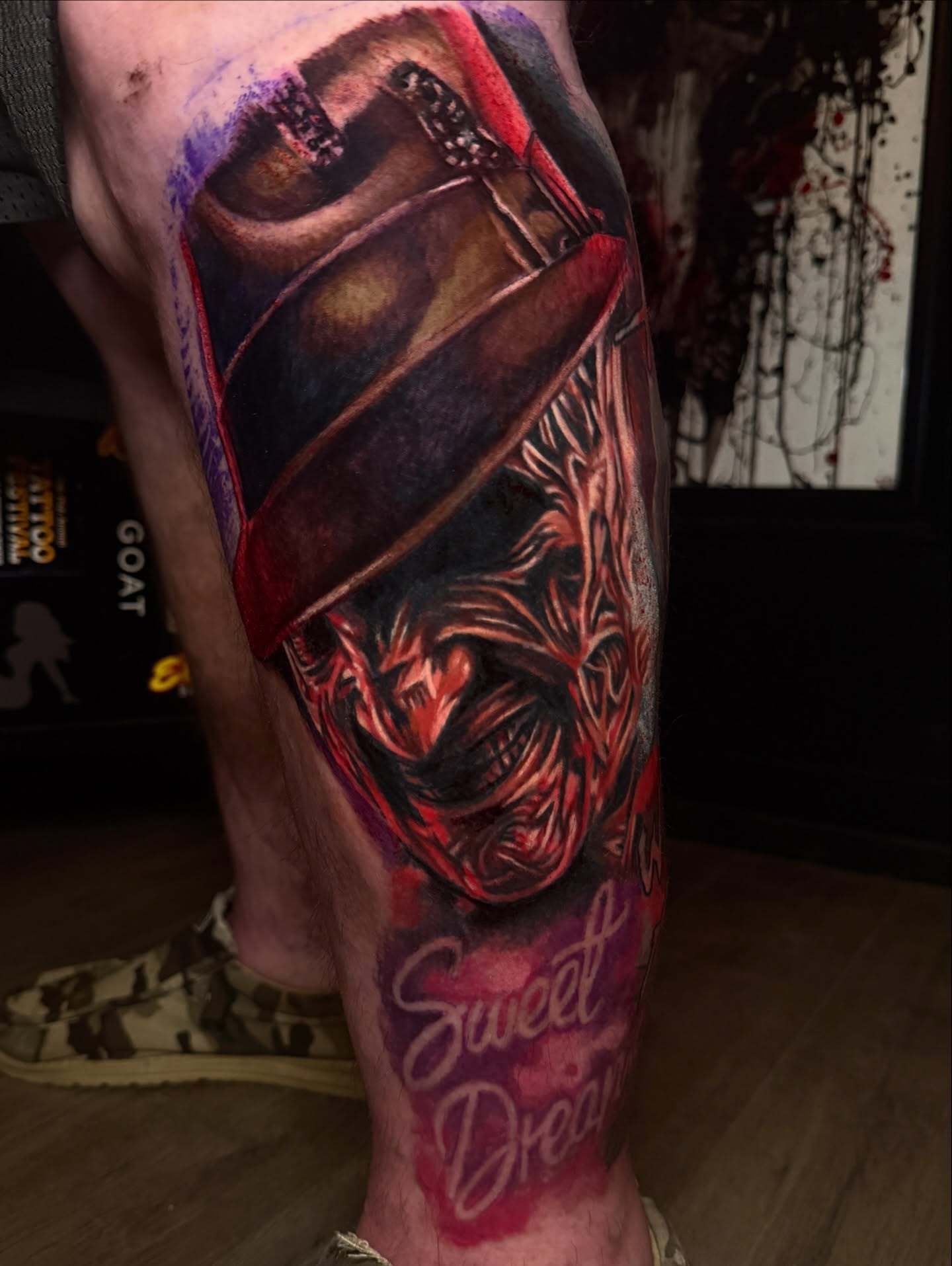 Demon dark realism tattoo on the calf by Scott Pizer