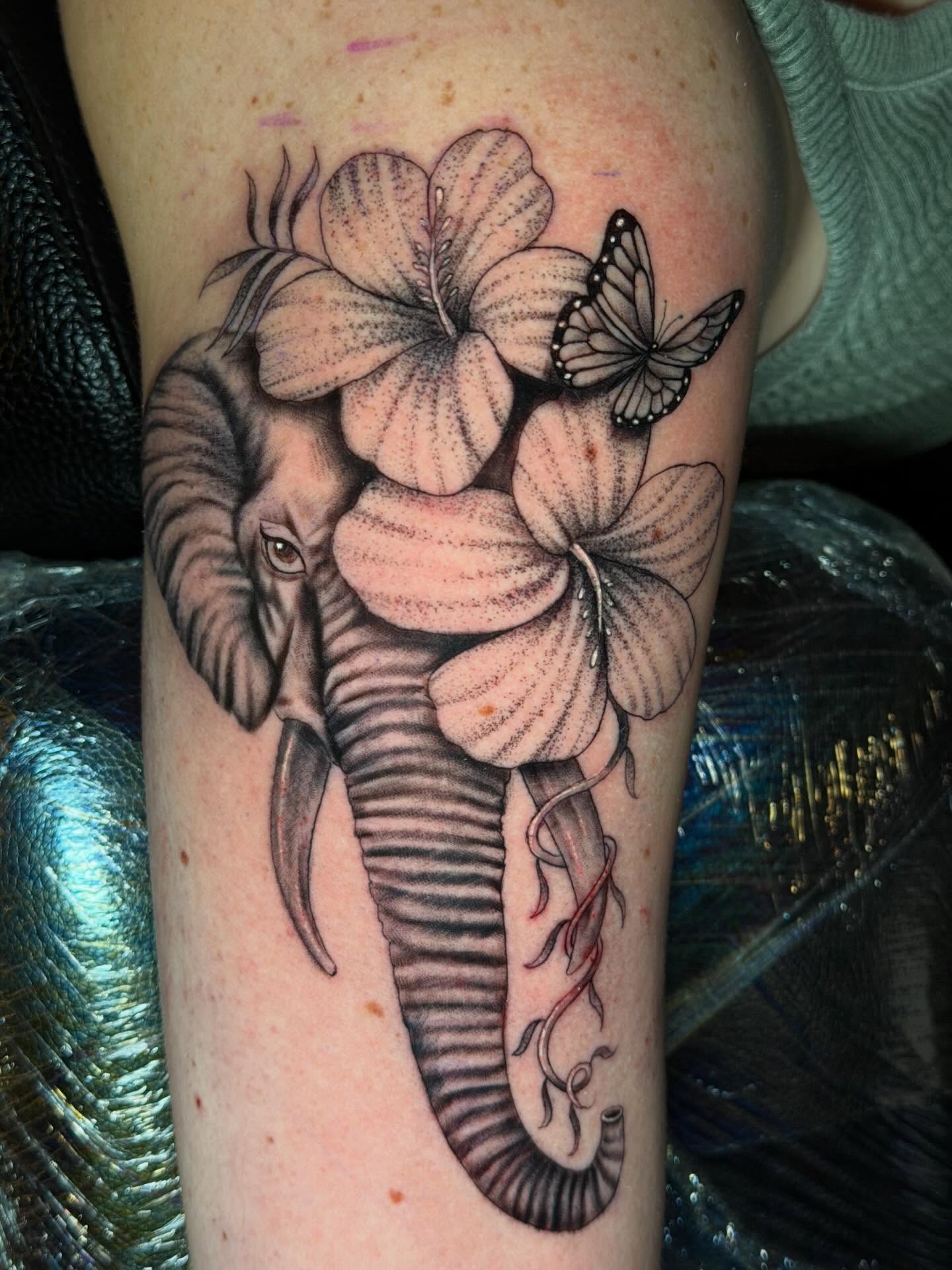 Elephant and flowers dotwork tattoo on the forearm by Dany