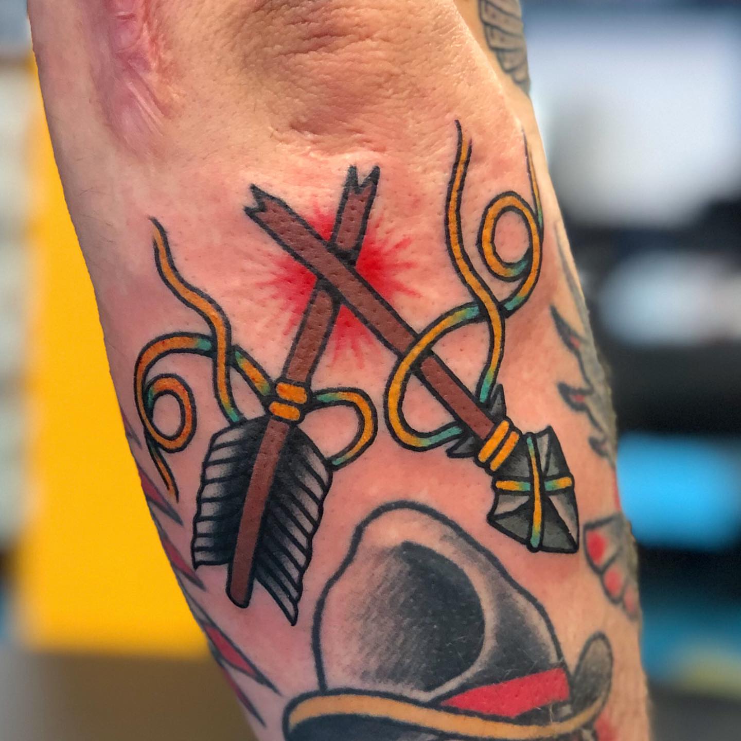 Bow and arrow American traditional tattoo on the forearm by Matt Klass