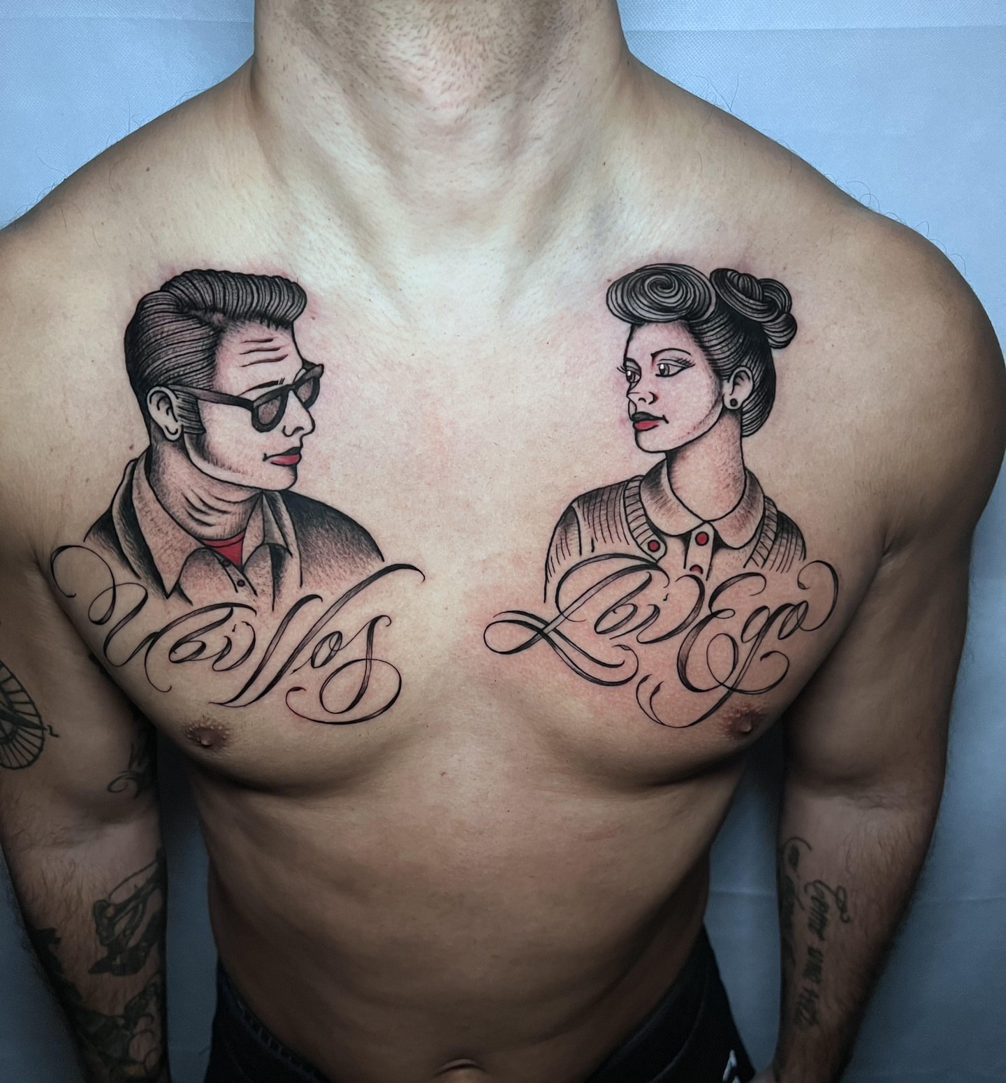 Couple portrait American traditional tattoo on the chest by Alessandro Pennella