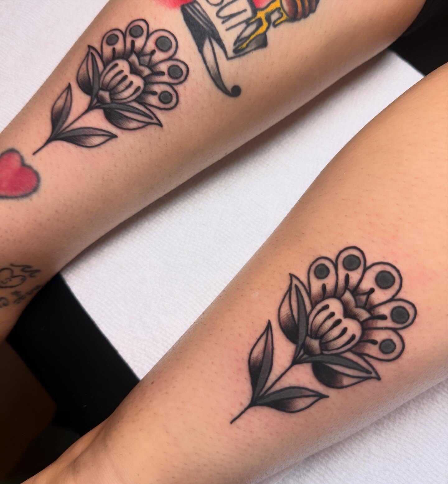 Flower black and grey tattoo on the forearm by Shelby