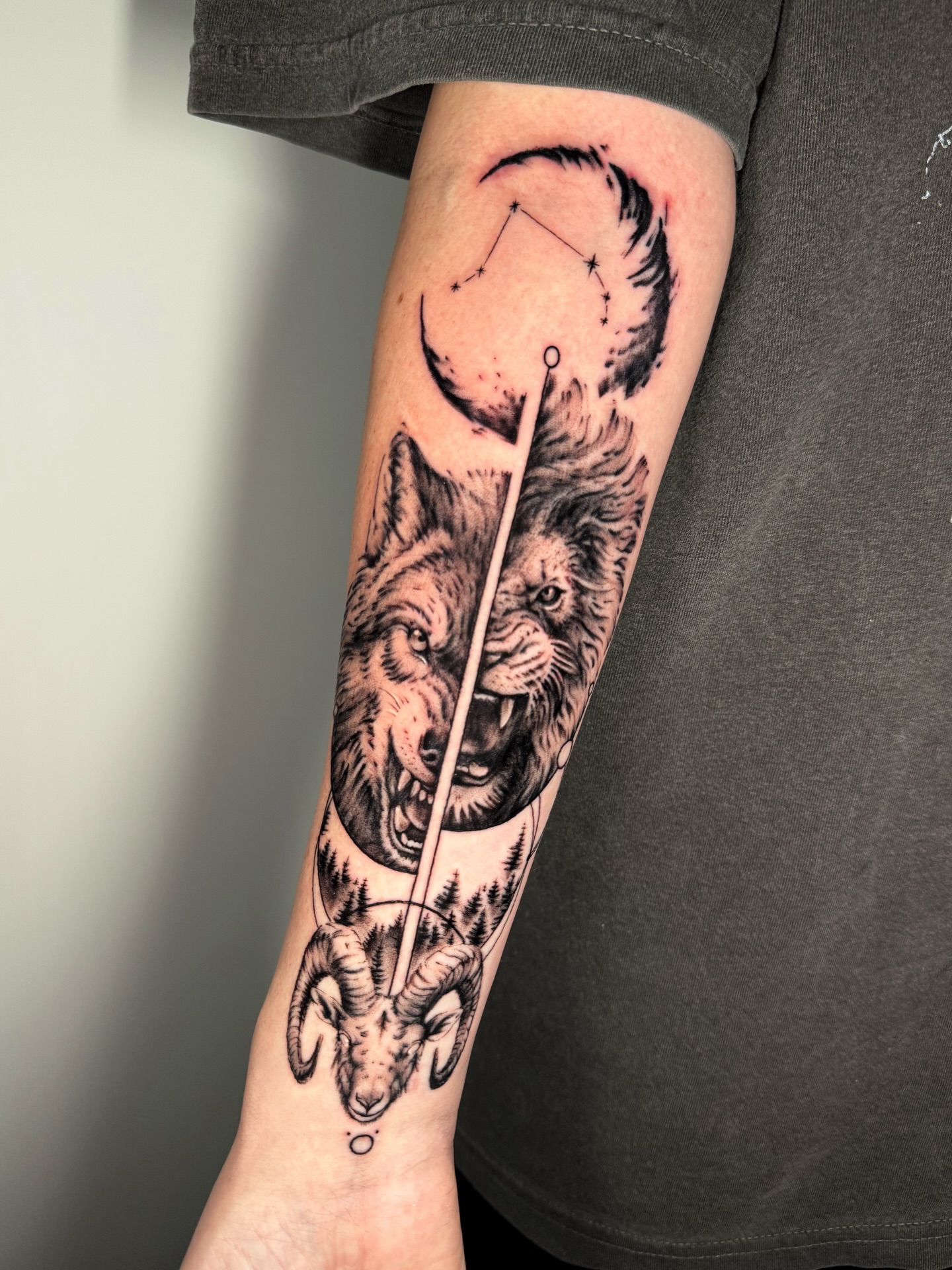 Wolf and ram realism tattoo on the forearm by Moi Rivas, Salt Lake City, Utah