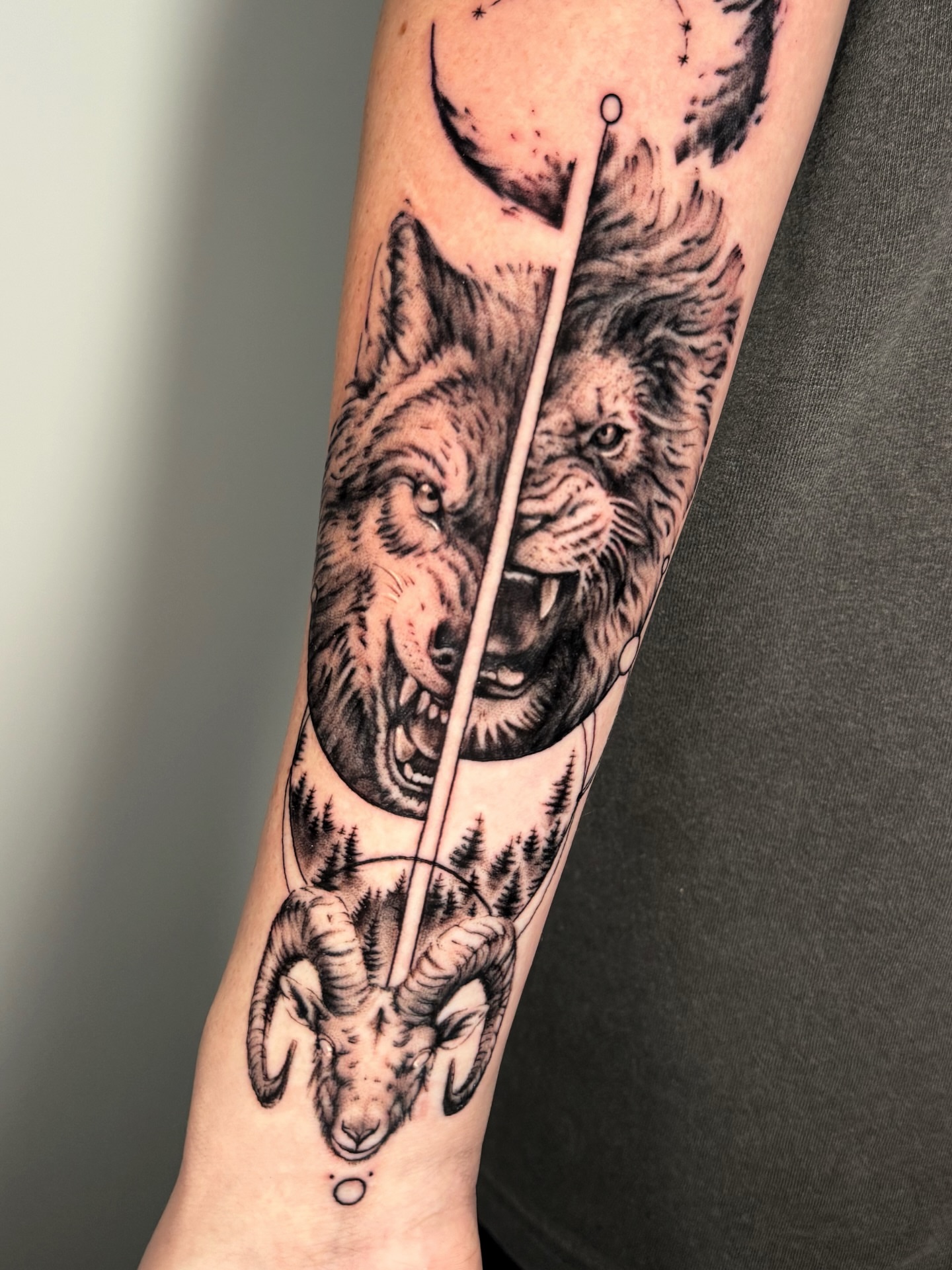 Wolf and ram realism tattoo on the forearm by Moi Rivas, Salt Lake City, Utah