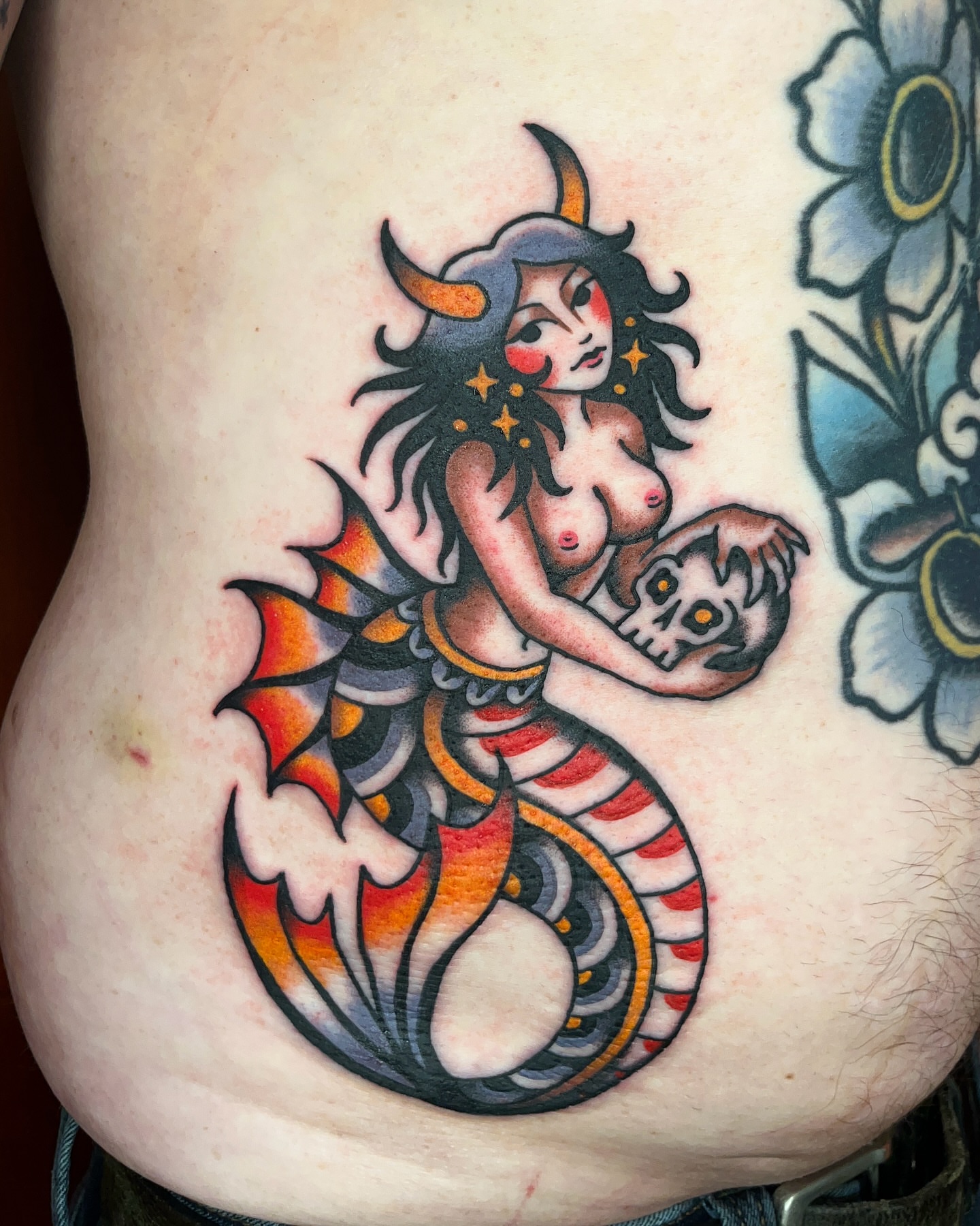 Mermaid holding skull American traditional tattoo by Nat Power