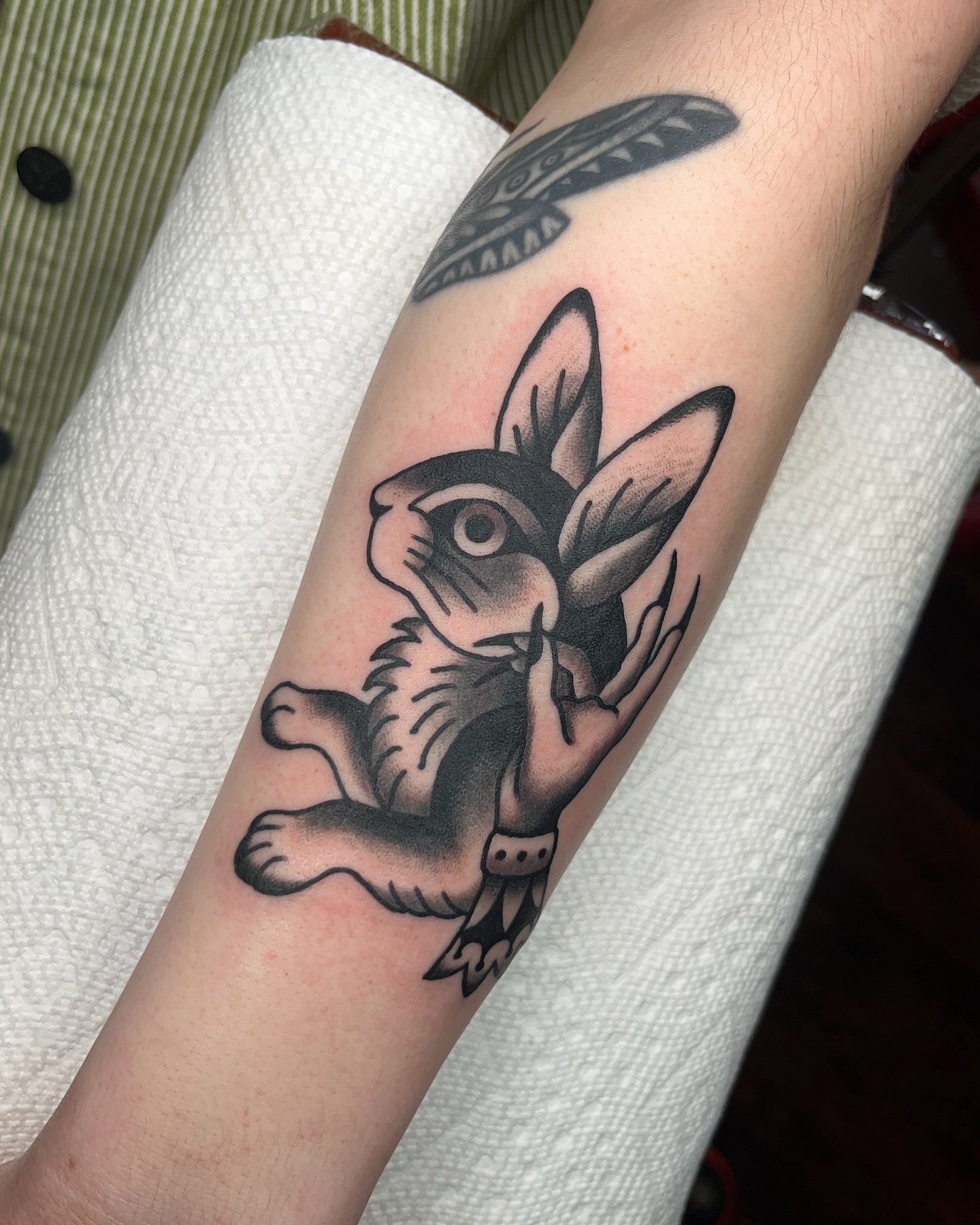 Rabbit American traditional tattoo on the forearm by Nat Power