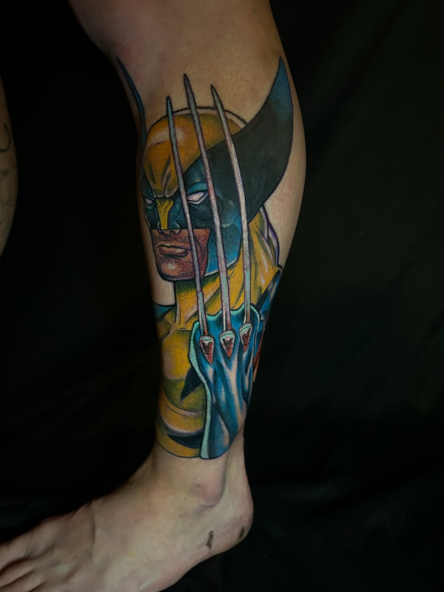 Wolverine new school tattoo on the calf by Ryan Willard, Denver, Colorado