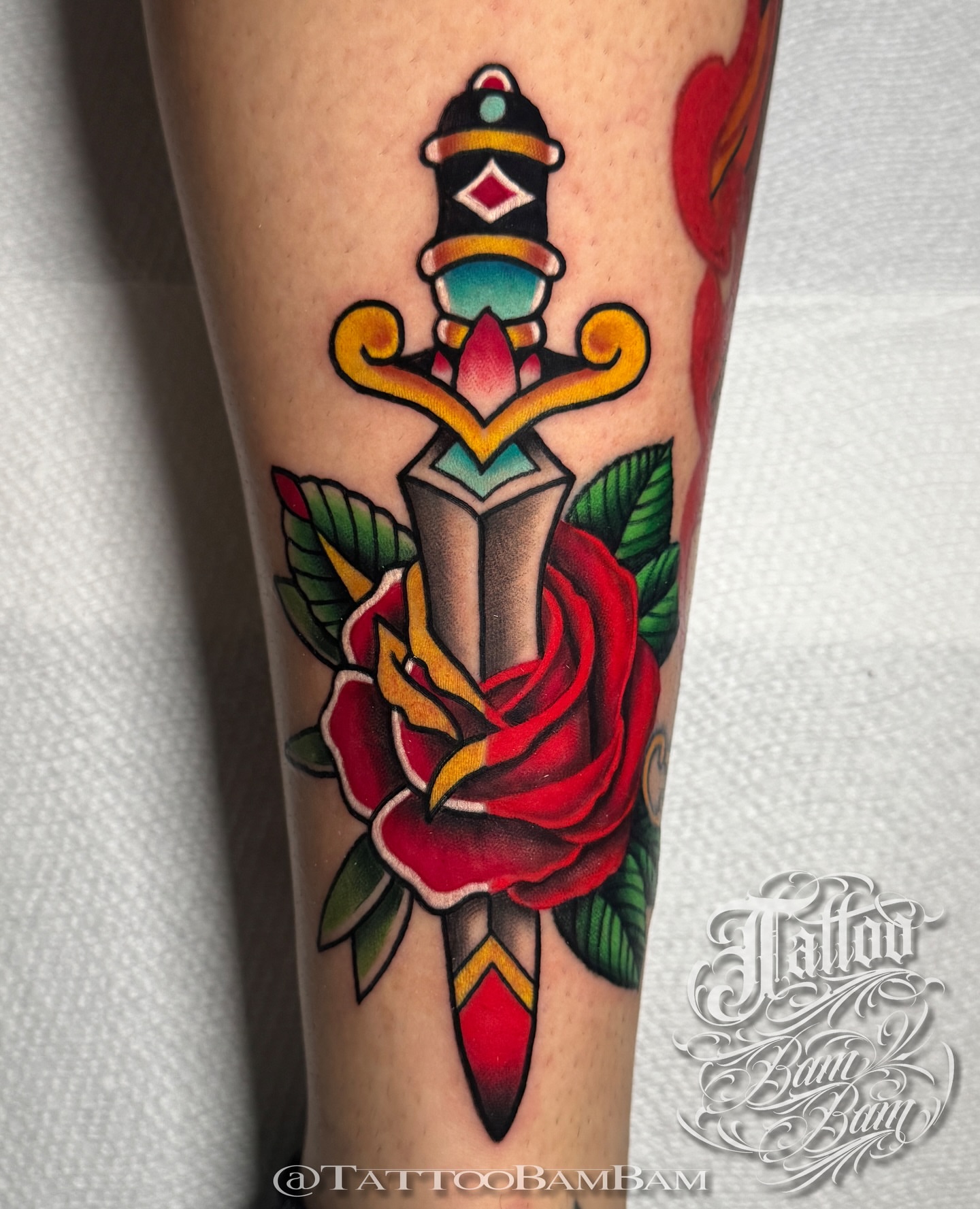 Knife and rose American traditional tattoo on the forearm by Tattoo Bam Bam