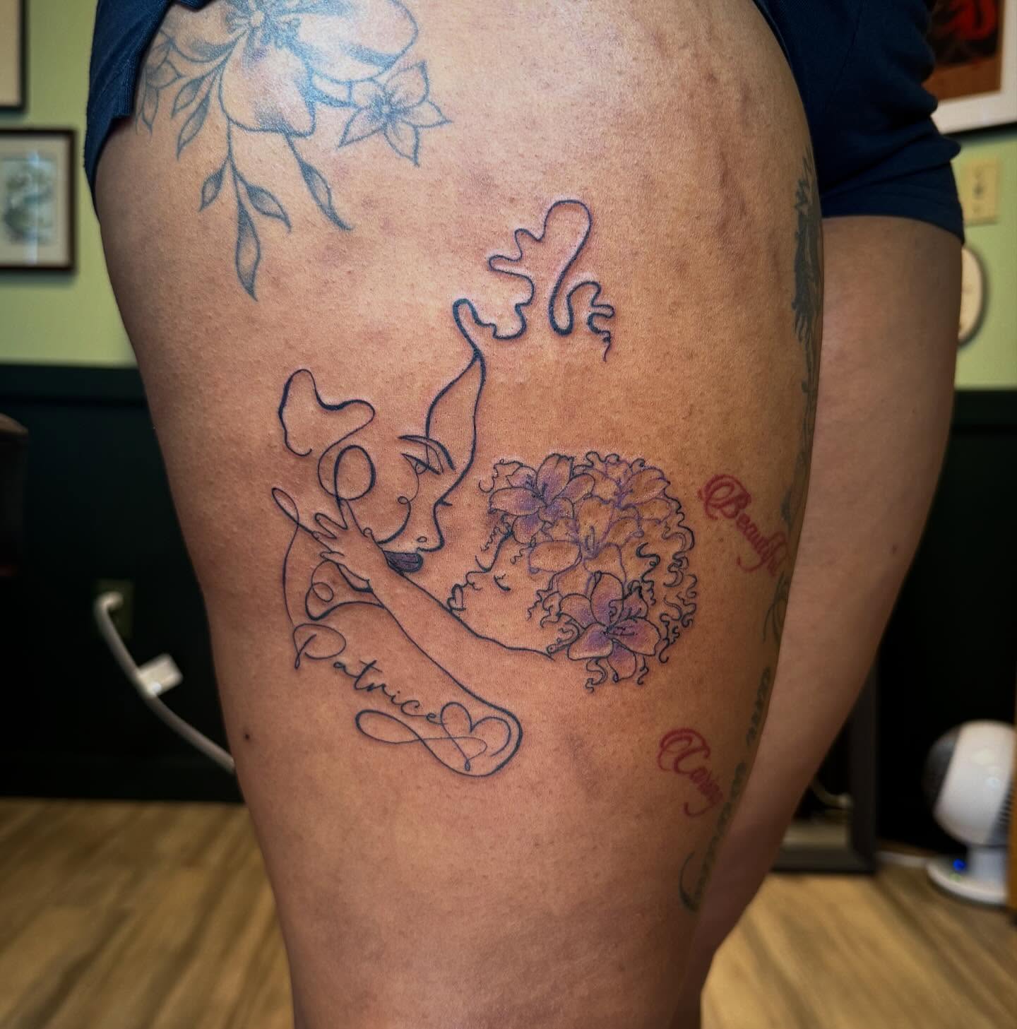 Woman with flowers fine line tattoo on the thigh by Taytum Marsing, Salt Lake City, Utah