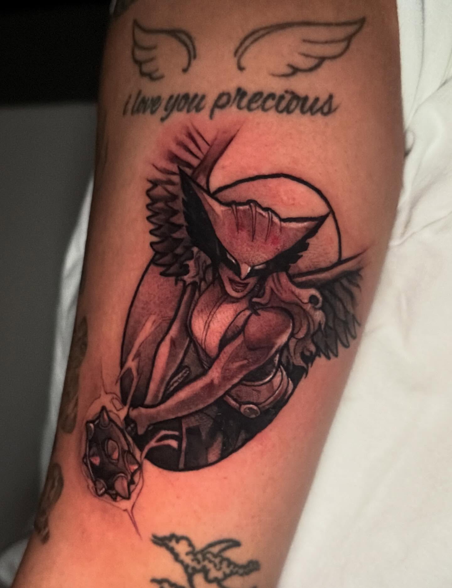 Woman with wings anime tattoo on the forearm by emi