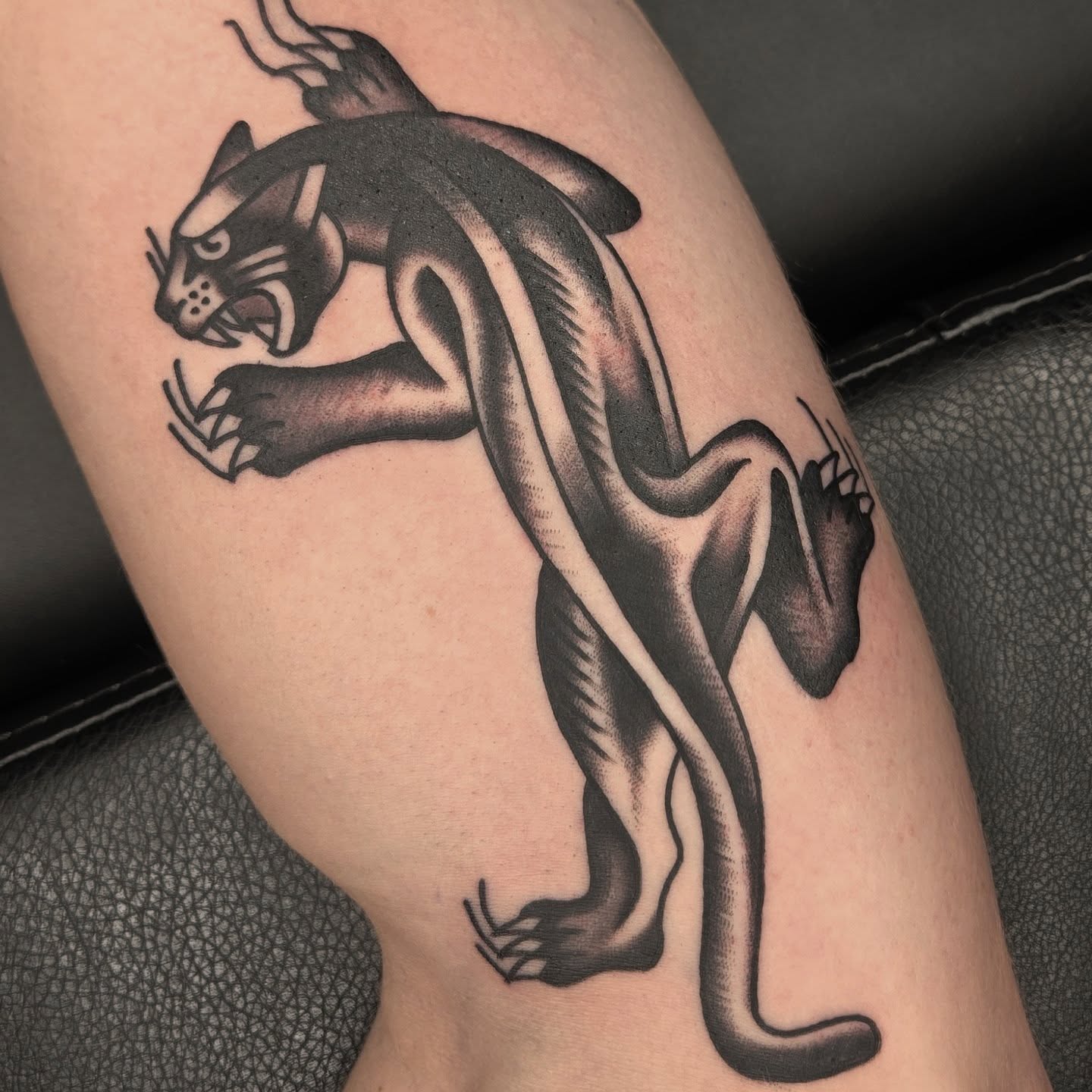 Panther black and grey tattoo on the leg by Deke Harms, Bend, Oregon