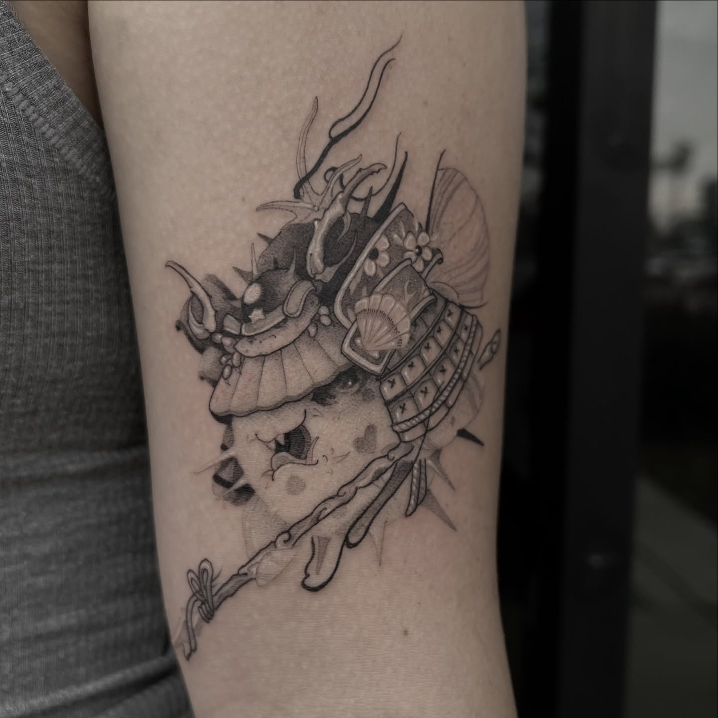 Samurai helmet black and grey tattoo on the forearm by Joshua Hung, Alhambra, California